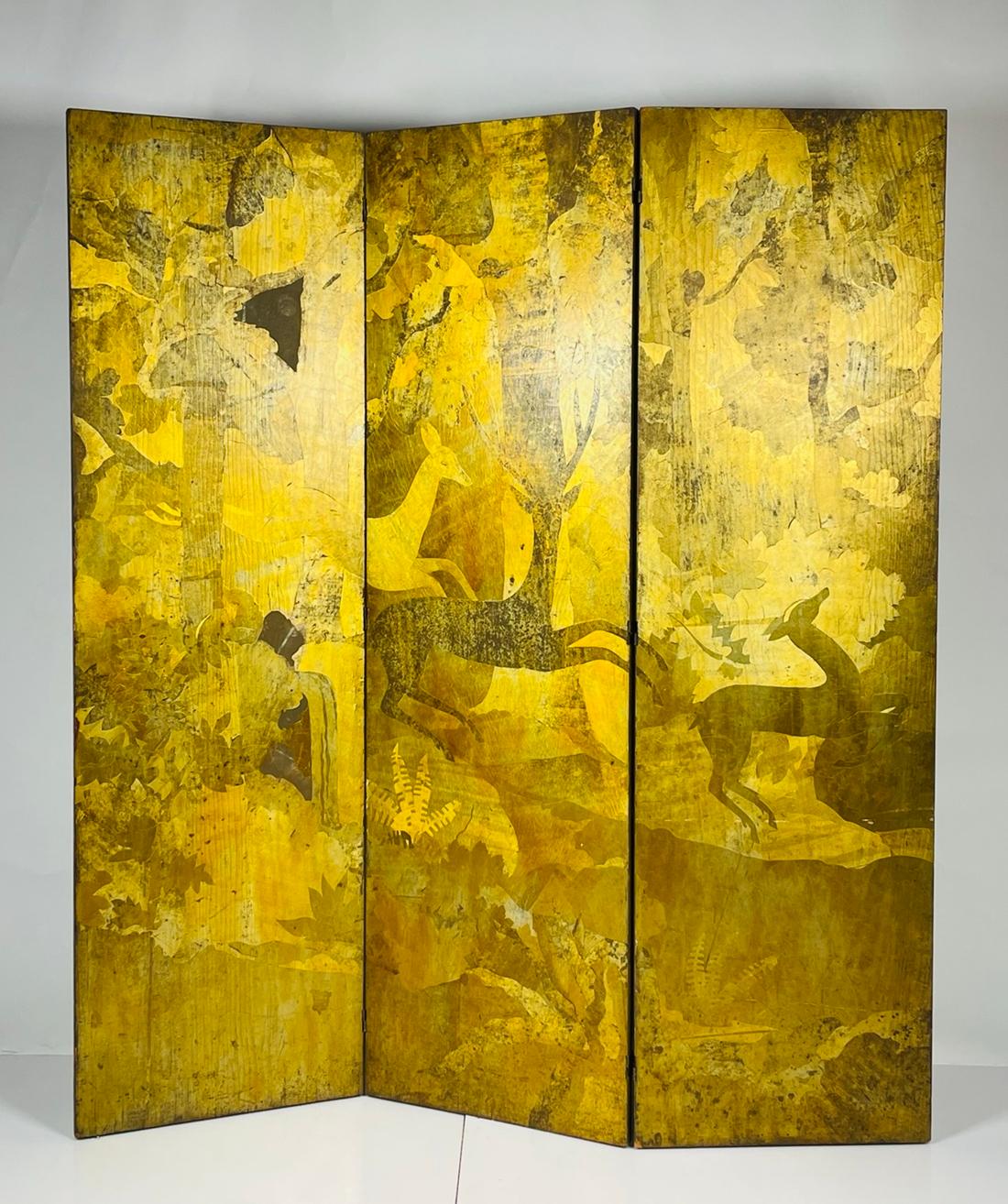 Vintage folding screen/room divider dating for the 1950s or earlier.
The piece is covered in gold leaf, the gold leaf depicts male and female deers.
The male deer have long horns, they seem to be roaming on a forest, the are trees and large