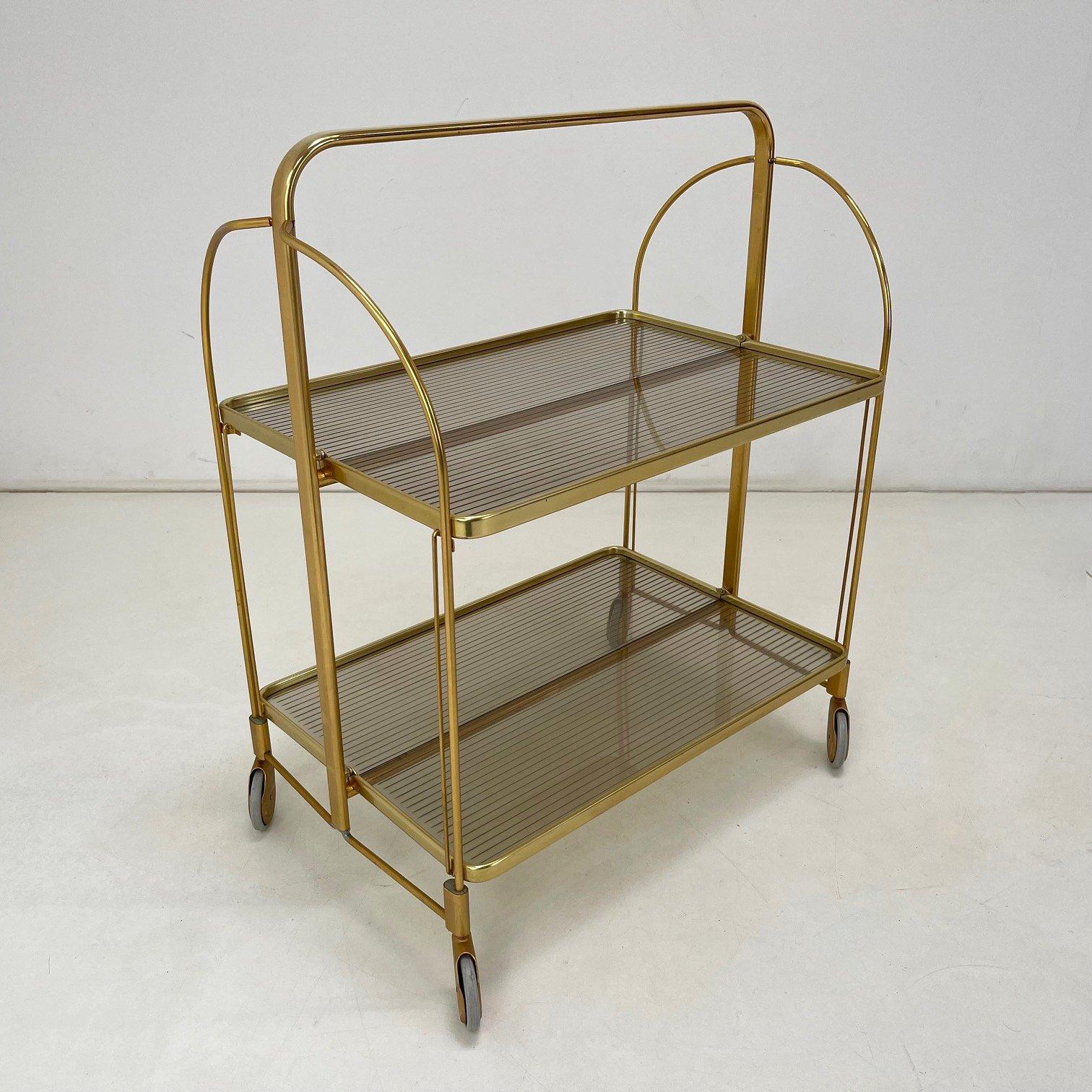 Folding serving cart made of metal and plastic in Germany in the 1960's.