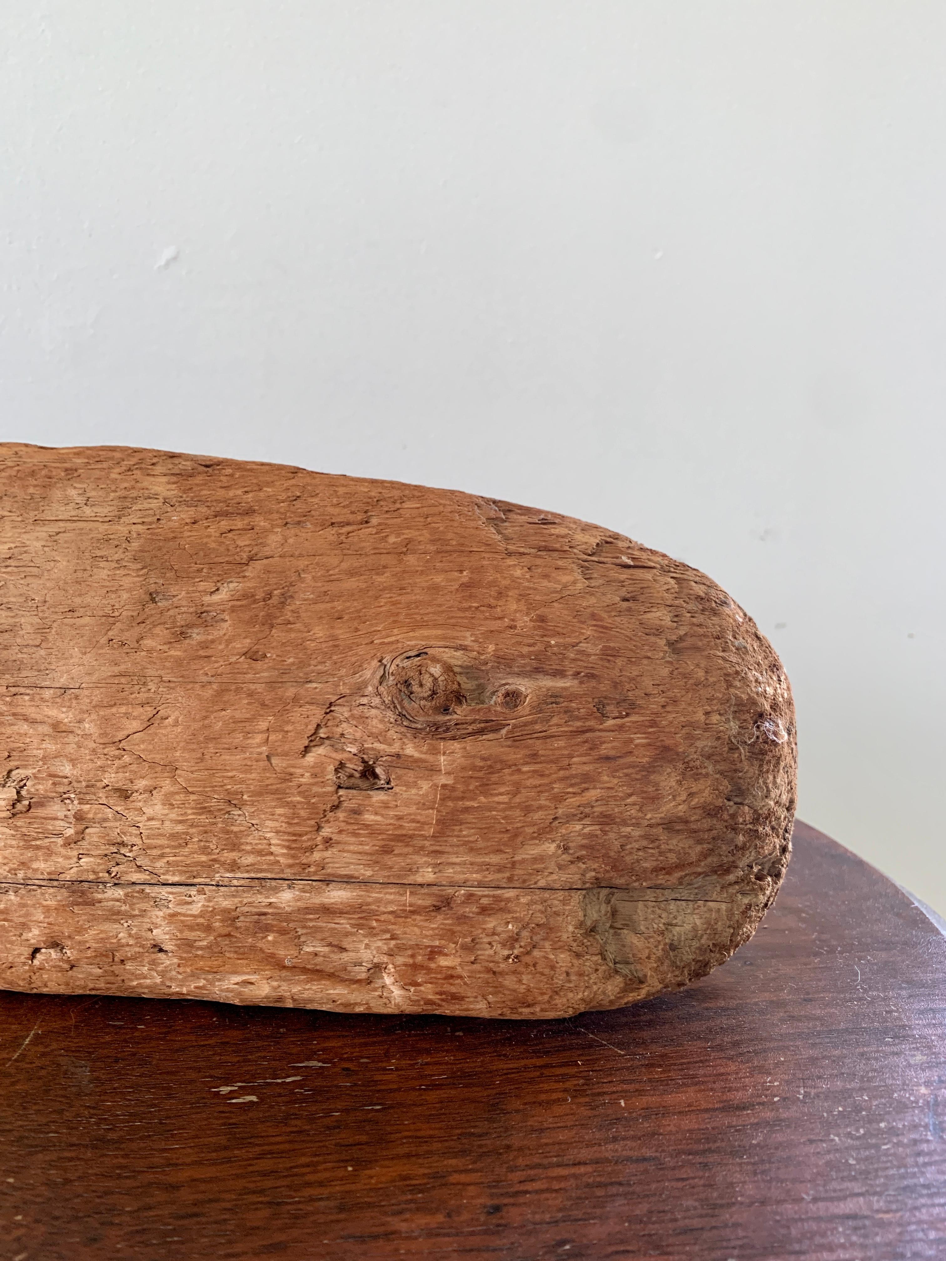 A charming Folk Art hand carved driftwood door stop or sculpture in the form of a whale, perfect for your Nantucket, Cape, or Hamptons home! 

USA, Early 20th century

Measuers: 30.5