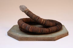 Vintage Folk Art Hand-Carved Wood and Bottlecap Snake on Octagonal Base