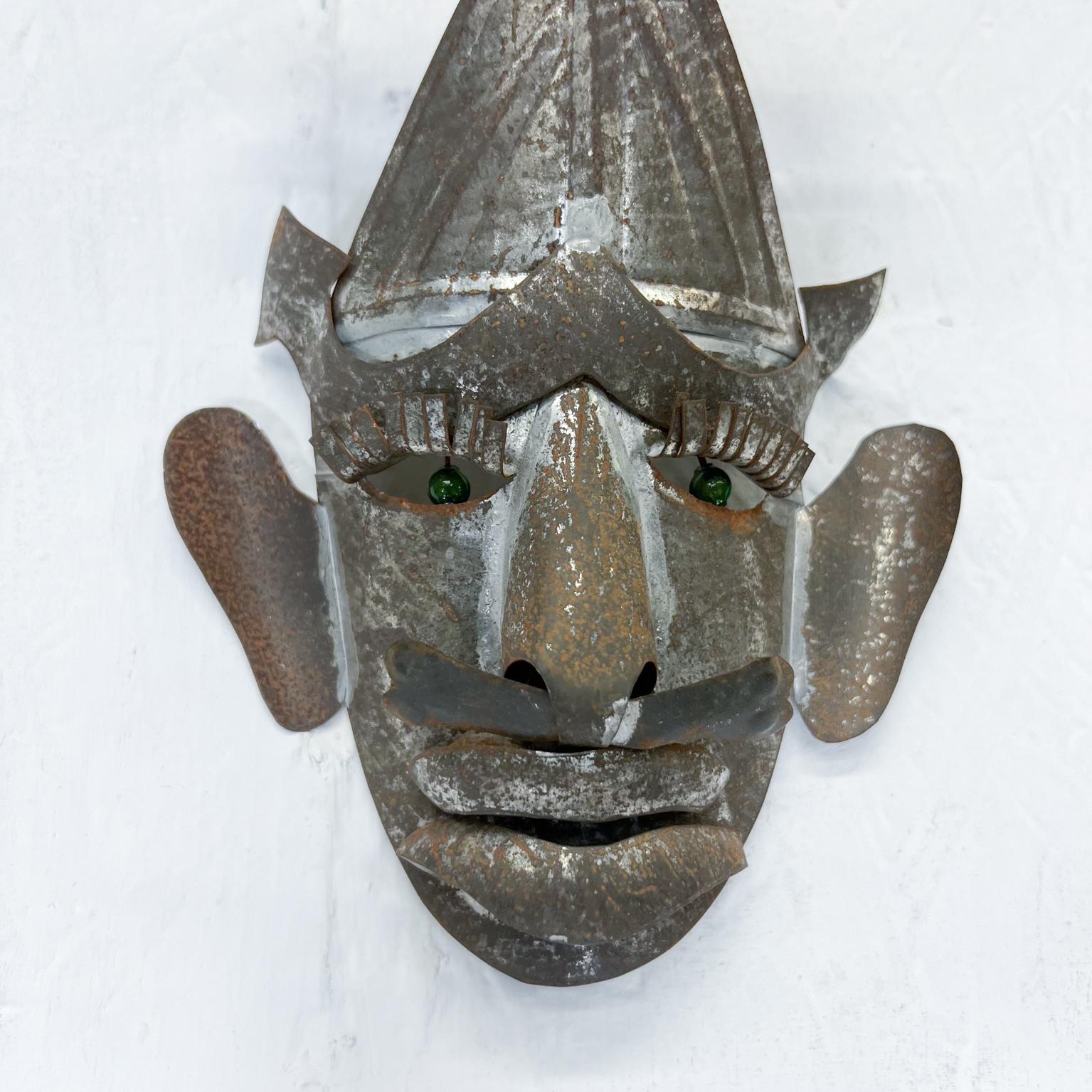 1950s Vintage Mexican Folk Art Metal Tin Mask with Piercing Green Eyes In Good Condition In Chula Vista, CA