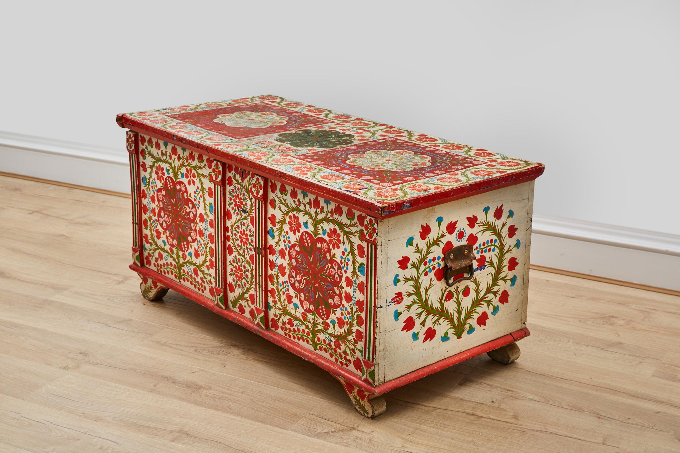 A Large vintage mid 20th century pine chest/trunk marriage box with hand painted folk decoration, the colour scheme and general design is traditional in style. 
The motifs comprise of tulips & foliage. 

This rare and charming piece is possibly of