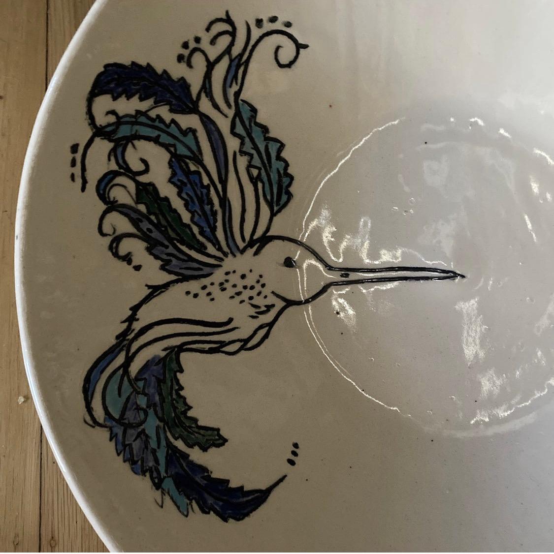 Beautiful ceramic fruit bowl with hand painted bird decoration. This folk art pottery bowl is marked, but we were unable to match it to a maker.

This bowl is in excellent condition, free of marks, cracks, crazing or chips.