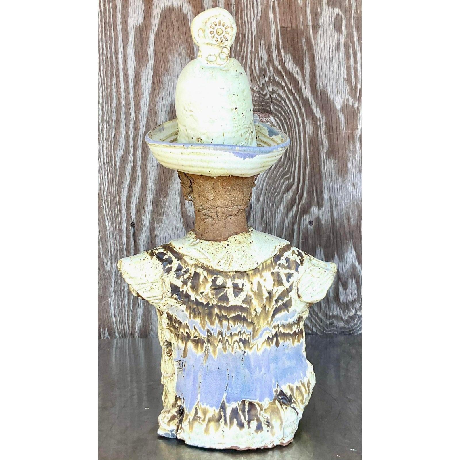 A fabulous vintage Boho sculpture of man. A chic slab built composition of a charming man in a hat. Beautiful hand painted detail. Acquired from a Palm Beach estate. 