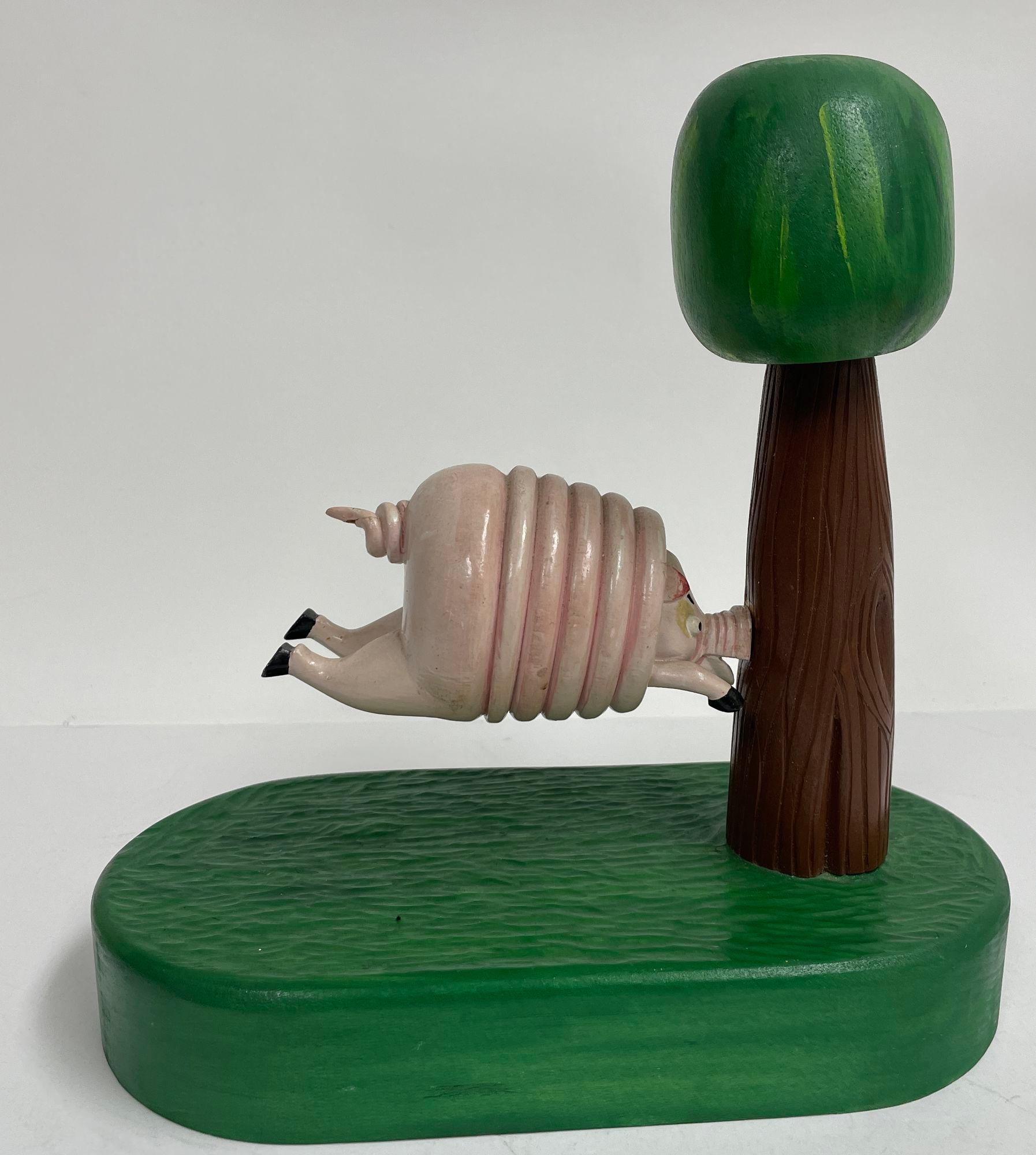 20th Century Vintage Folk Art Wood Sculpture of a Pig Running into a Tree by R. Harper 1991 For Sale