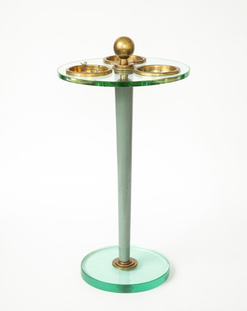Effortlessly elegant green glass and brass ashtray/vide poche side table in the manner of Fontana Arte. 