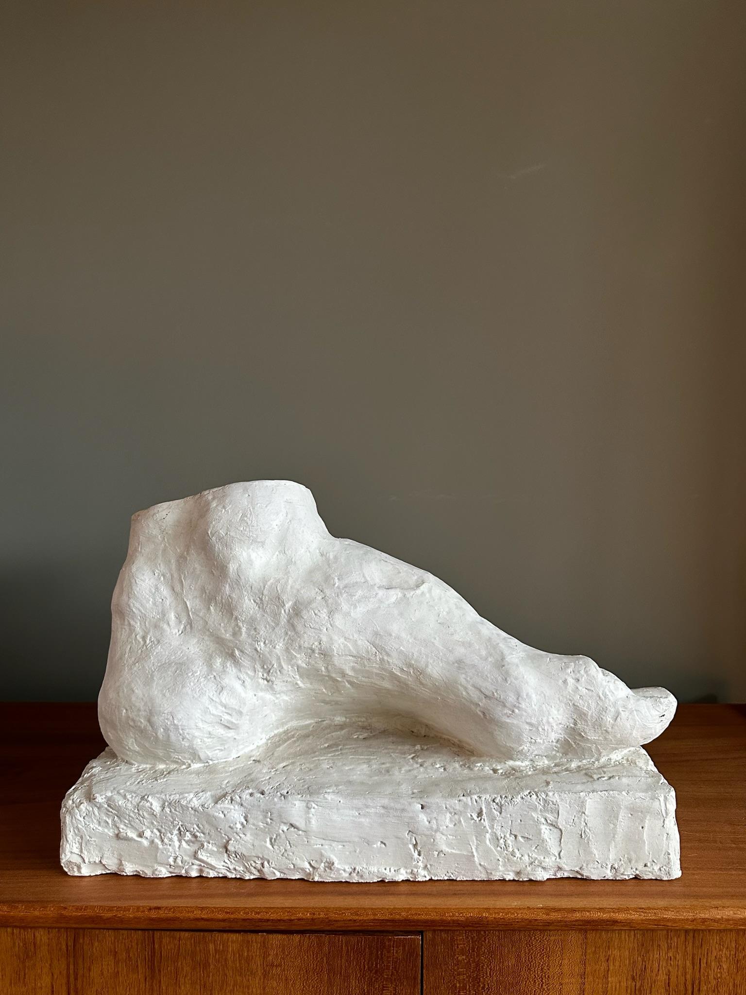 Very big foot, cast, made out of plaster.
This one is made around 1900. 
At Art colleges students learn to drawn with these plaster casts. 
Made in Belgium.

Now it's a beautiful piece of art that will be great in your interior design.

The size is