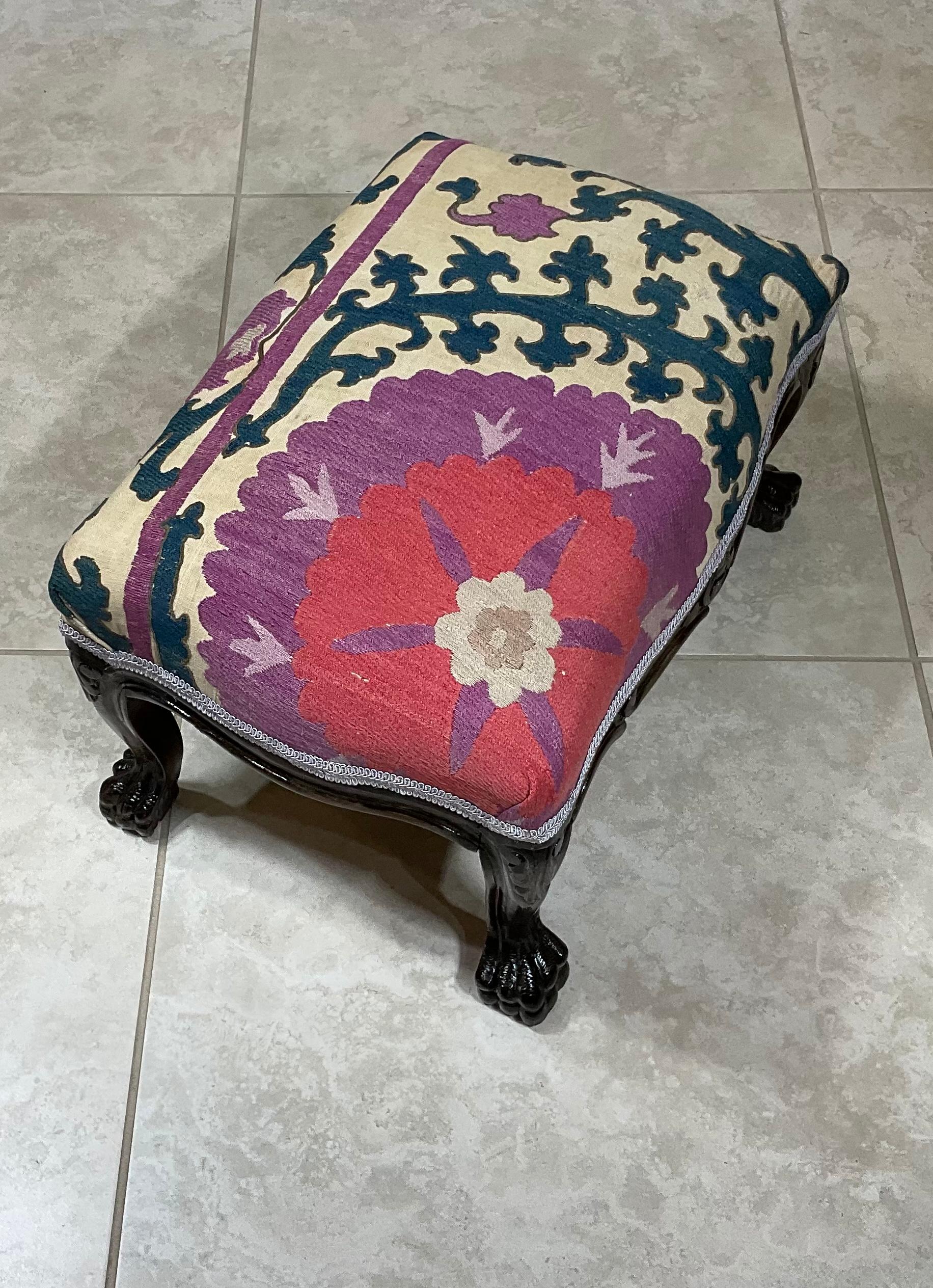Elegant foot stool made of hand carved wood, upholstered with beautiful antique hand embroidery Suzani textile, beautiful trimming. Newly upholstered, some professionally textile repair see photos, great decorative foot stool.
    