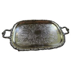 vintage footed butler tray silver plate. With lion shape engraved at the back