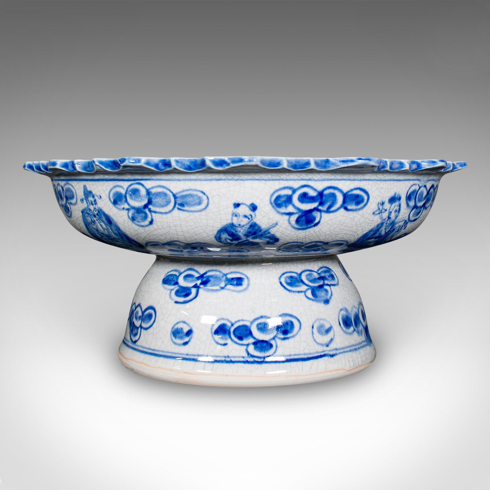 This is a vintage footed serving bowl. A Chinese, ceramic fruit or bonbon dish with Emperor motif, dating to the mid 20th century, circa 1950.

Charming small bowl, ideal for serving fruit or display purposes
Presents a desirable aged patina and in
