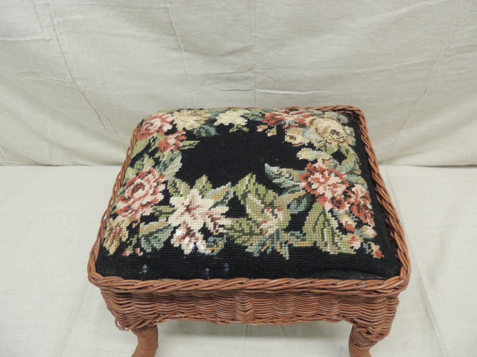 Vintage footstool with antique style needlepoint tapestry
upholstery, rattan frame.
Size: 13