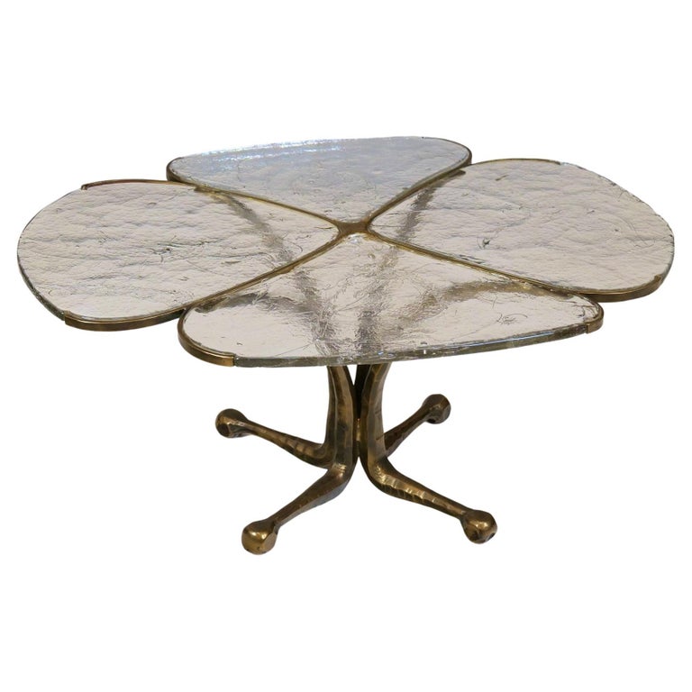 Original bronze table by Lothar Klute with signature and certification. 

This exhibit in particular is a masterpiece by Lothar Klute. It consists of four glass panes that are firmly anchored in bronze.
The top of the table, which is inspired by a
