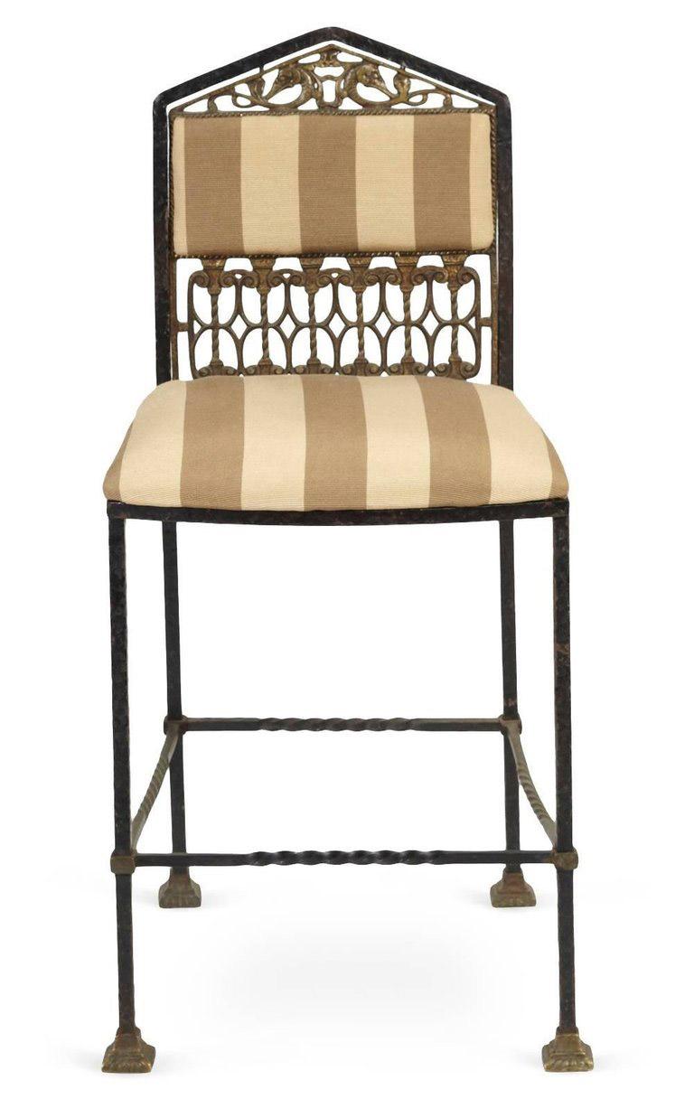 Forged iron and brass chair with pediment top, molded details of stylized fish and Venetian-style columns. Upholstered in striped ribbed fabric. Great for vanity table, vanity chair, vanity stool.
Search terms: Hollywood Regency style chair or
