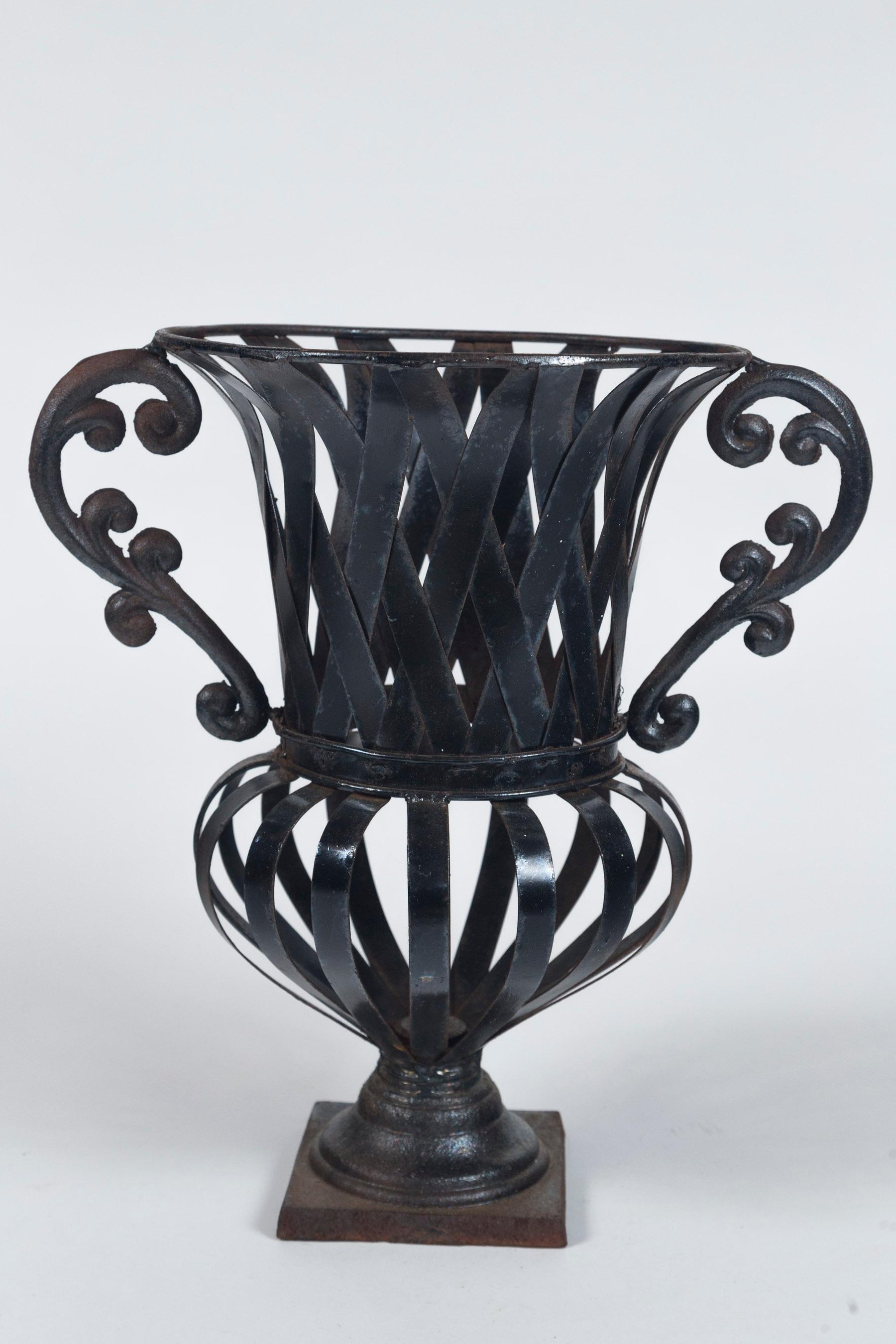 Vintage forged iron Urn, circa 1930's. Classical urn shape on square base with cast iron handles.
