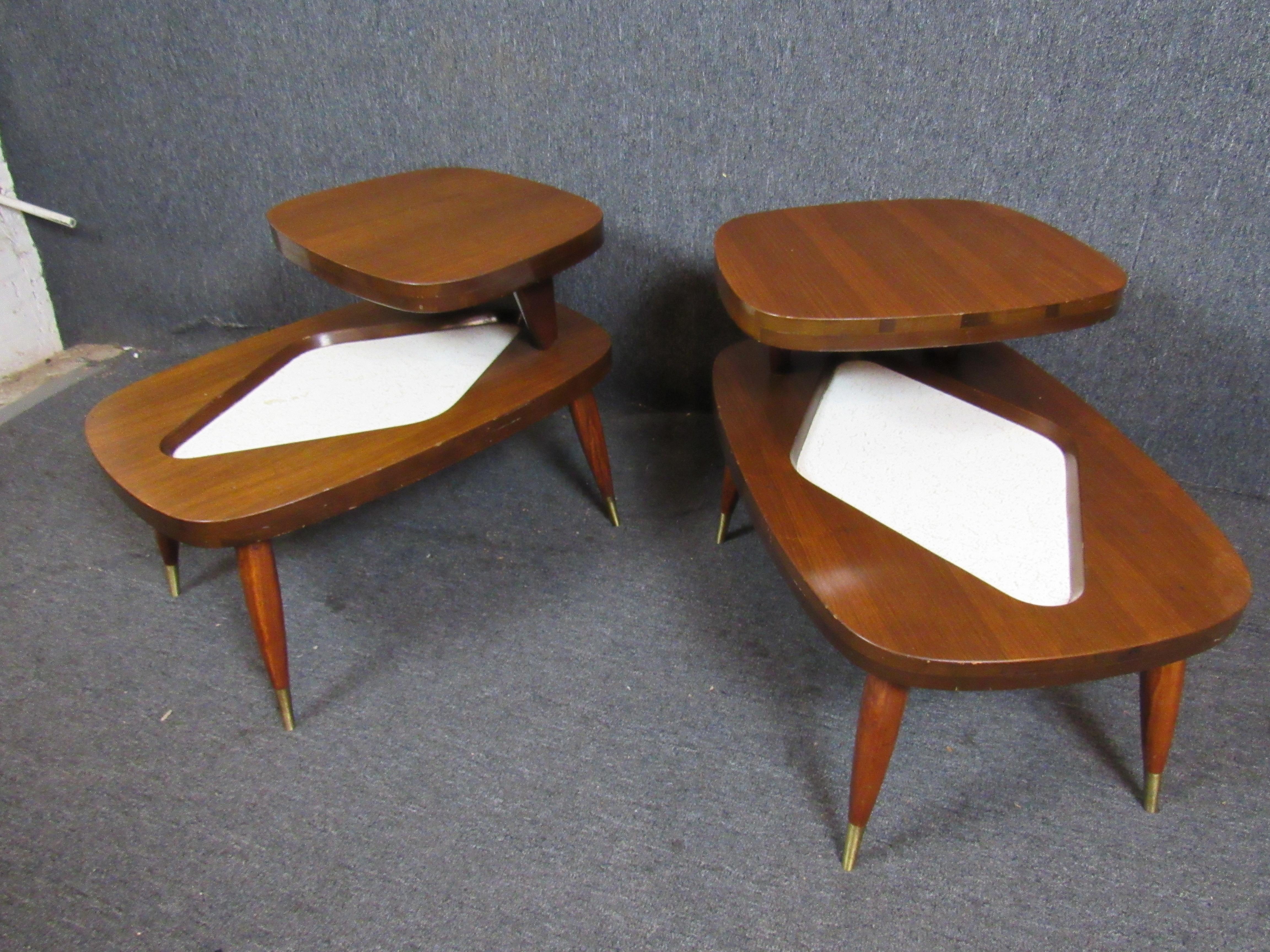 Absolutely fantastic pair of unique formica & walnut end tables. A funky two-tiered design is as practical as it is appealing. A perfect addition for any retro room in the home or office. Please confirm item pickup location (New York or New Jersey)