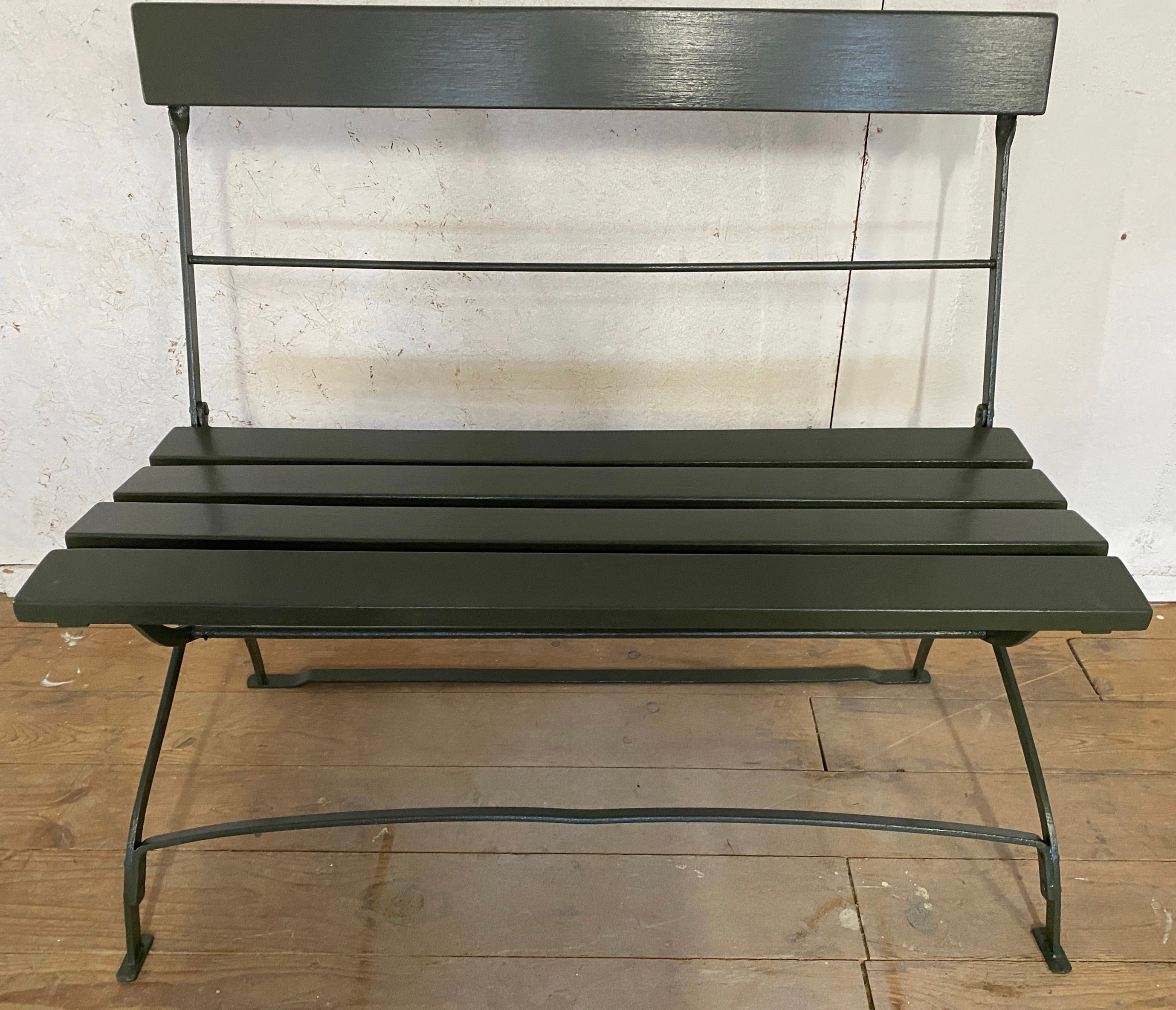 This vintage park or garden folding wood bench, painted in a forest green, has an iron structure with wood. slats in the back and seat Use indoor or  outdoor or anywhere where extra seating is needed.
Great for the garden, porch, patio or veranda.
