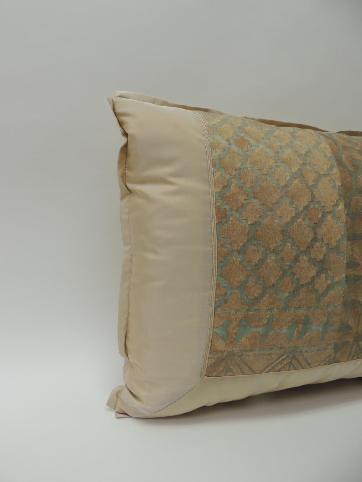Vintage Fortuny “Ashanti” copper on silver bolster decorative pillow handcrafted in a patchwork decorative style. 
Framed with ecru color silk same as backing and matching ATG decorative flat silk trim. And embellished with silk flat ribbon at the