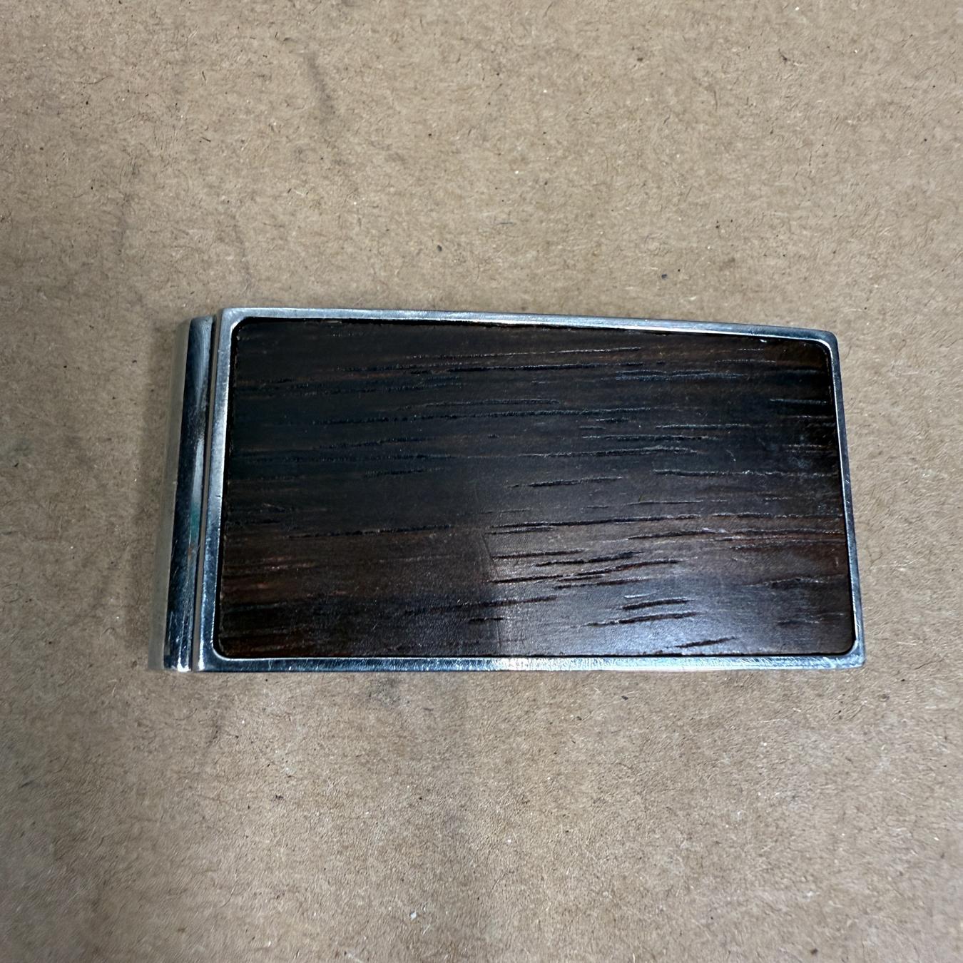 Vintage Fossil Money Clip Wood Silver Metal
Modernist design
1 x 1.88 x .38
Preowned original vintage condition
Refer to images please