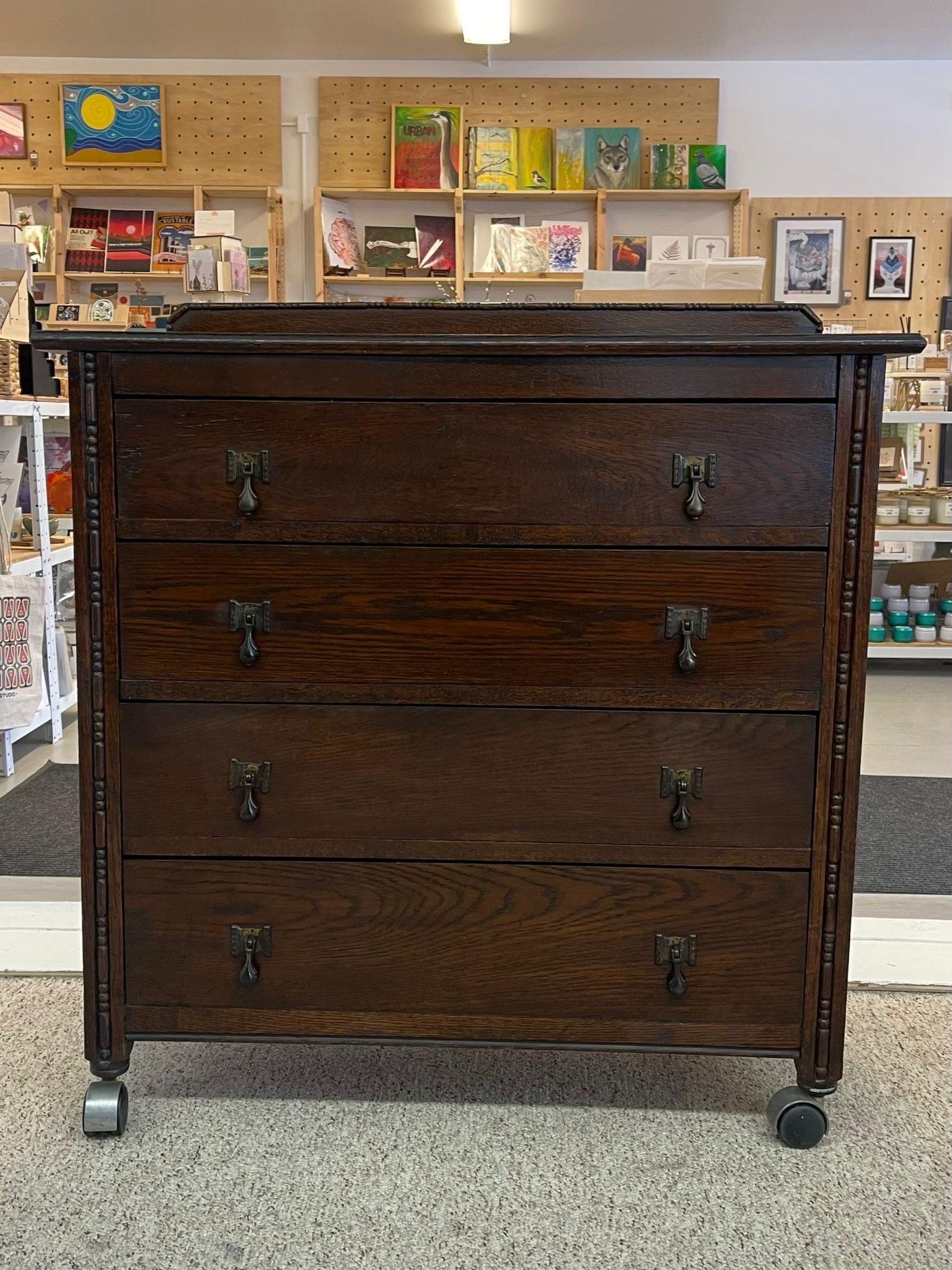 This Dresser Features four dovetailed drawers and original drop pull hardware. Finished back. Curved wood detailing on the front and top of dresser. Vintage Condition Consistent with Age as Pictured.

Dimensions. 36 W ; 18 D ; 38 H