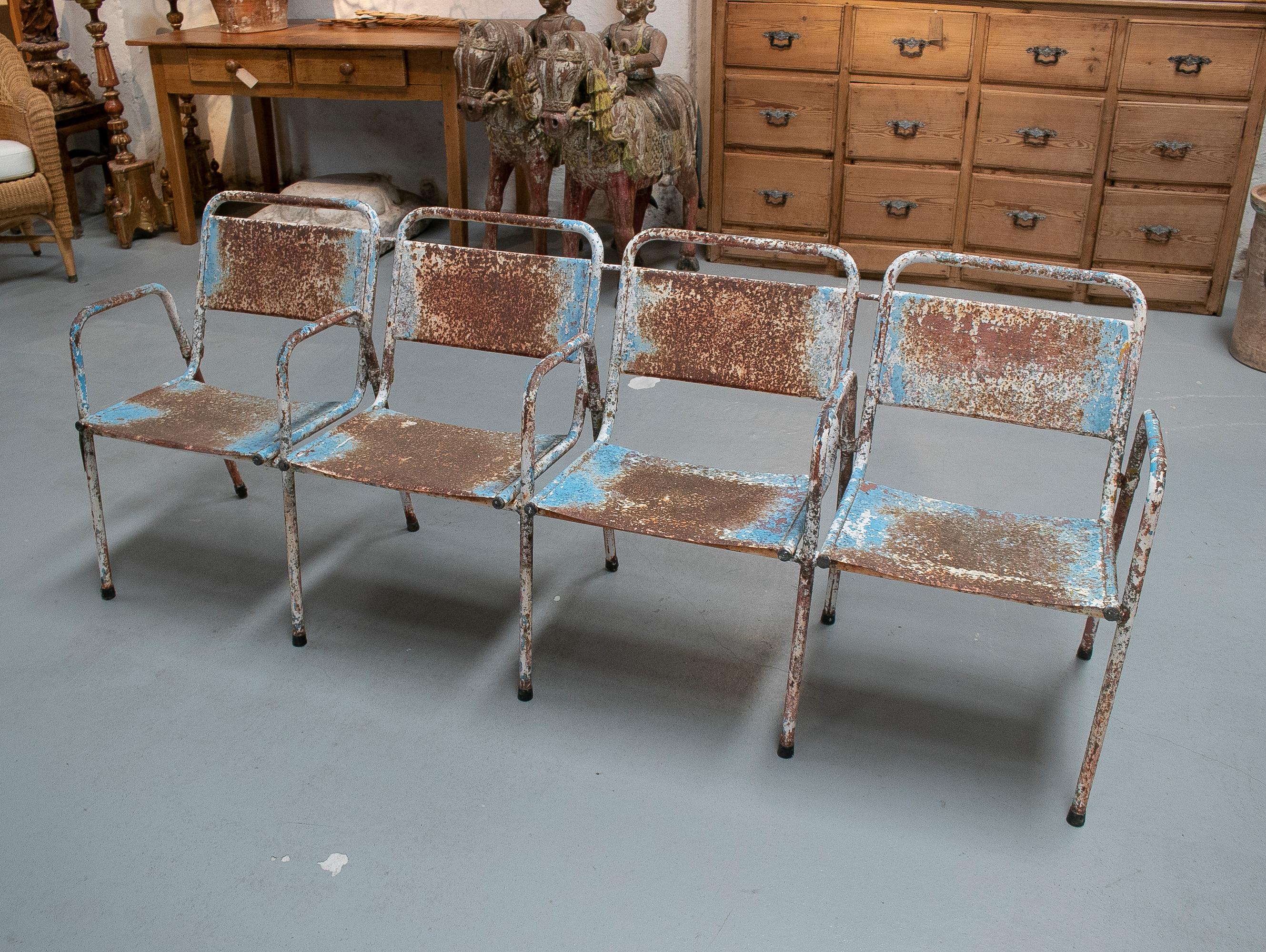 Vintage four-seat 1970s Spanish iron cinema bench.