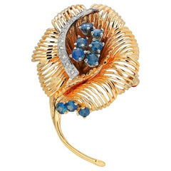 Vintage Fourteen Karat Yellow Gold Diamonds and Sapphires Floral Brooch Pendant