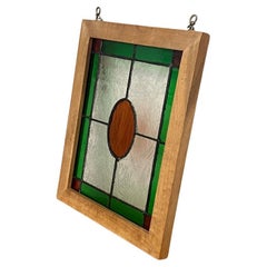 Vidriera vintage enmarcada verde y naranja