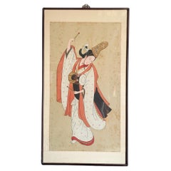 Pintura japonesa vintage enmarcada en seda de una bailarina tocando el tambor