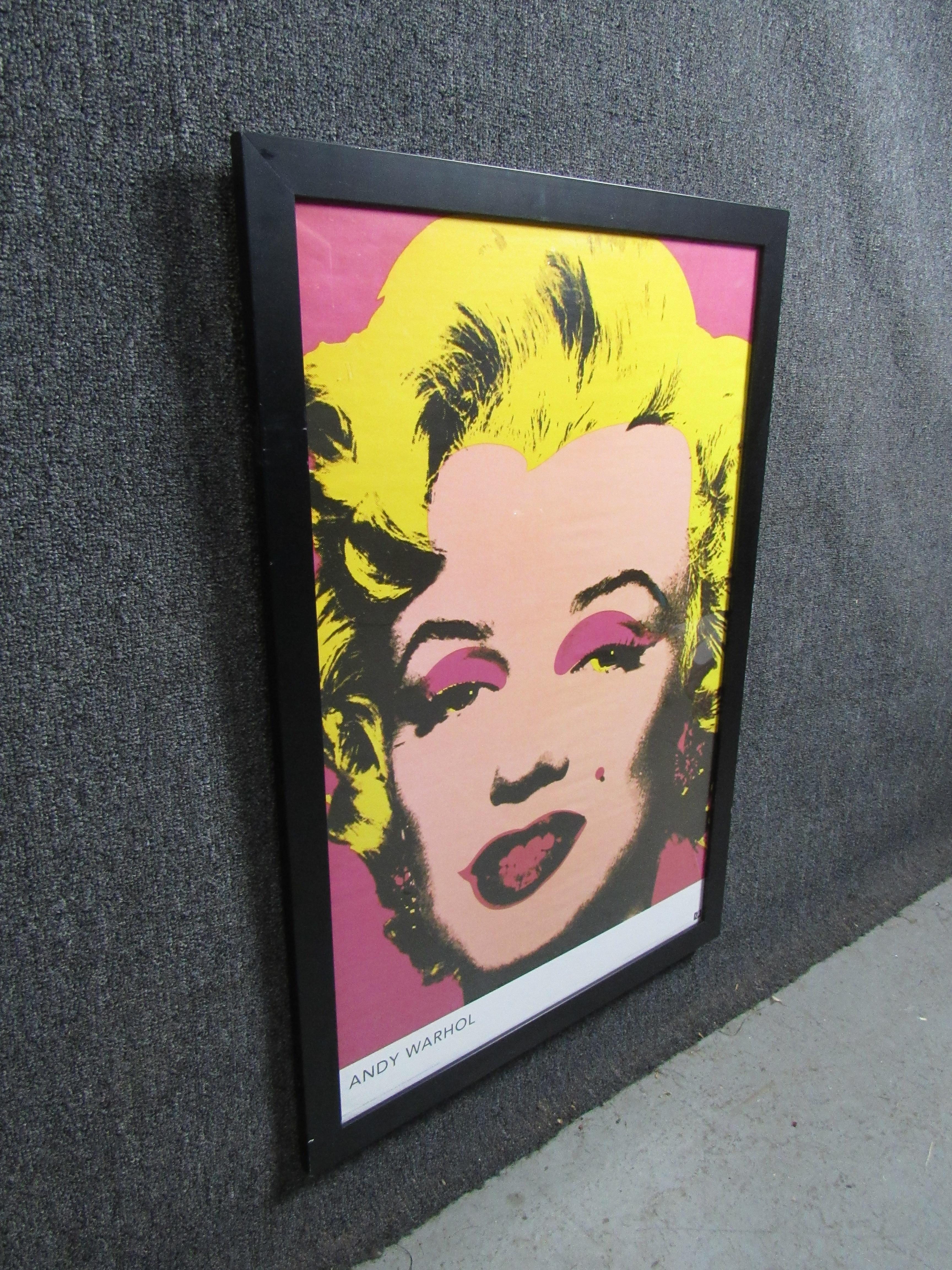 Bring home timeless American pop art with this vintage framed poster. Featuring Andy Warhol’s iconic Marilyn Monroe screen print, the vibrant pinks and yellow are sure to add a classic touch to any room. Please confirm item pickup location (Brooklyn