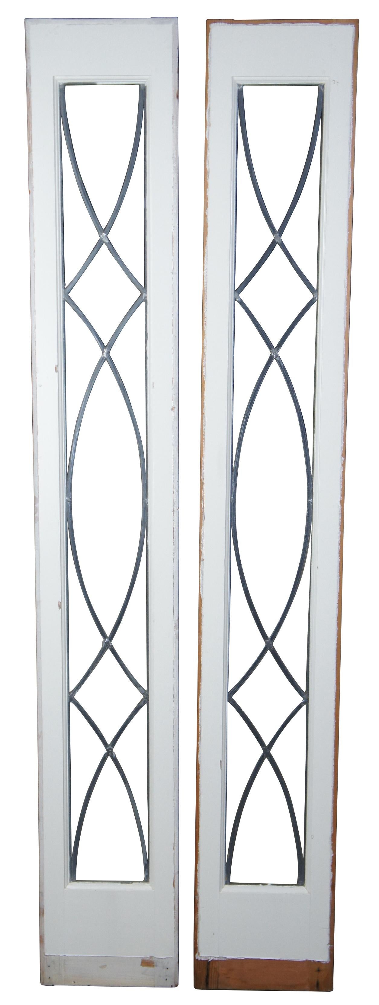 A beautiful pair of framed sidelight windows. Painted pine with graceful leaded design.
  