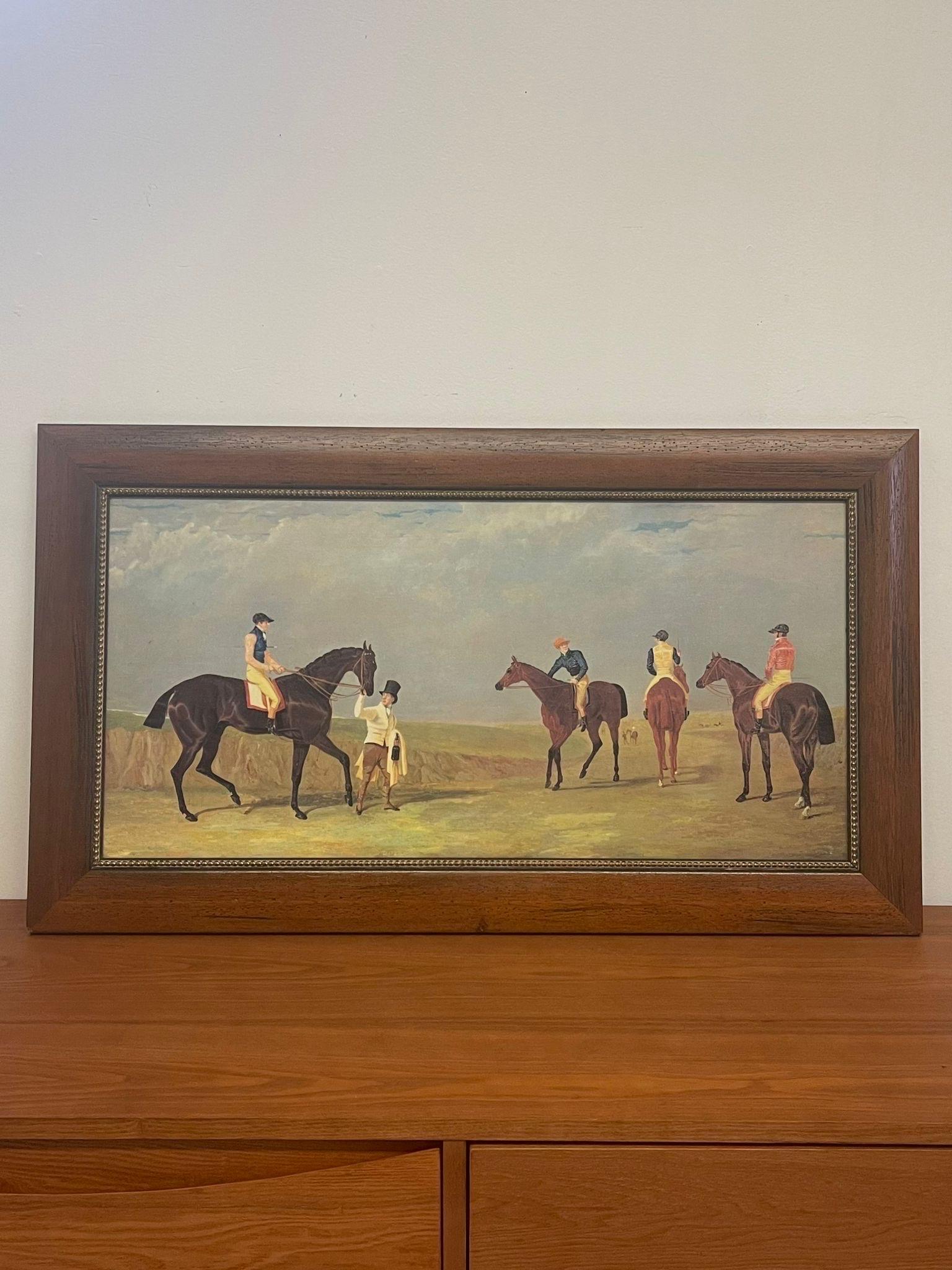 Vintage Print of Equestrian Riding through a Field on Canvas. Wooden Frame. Vintage Condition Consistent with Age as Pictured.

Dimensions. 38 W ; 3/4 D ; 21 1/2 H