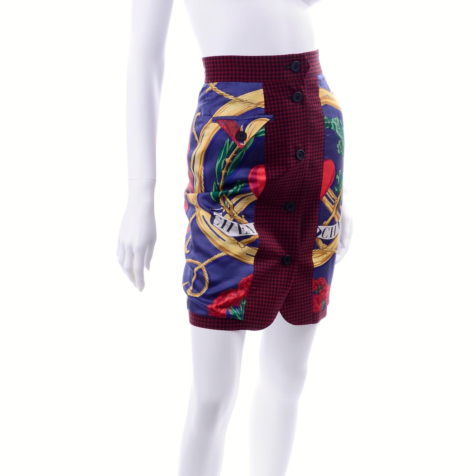 This is a wonderful vintage Moschino Pret a Porter skirt designed by Franco Moschino in the early 1990's. The fabric is 100% wool in a navy nautical print with red carnations, green vines, pink/red fans, and red and black plaid.  The skirt is lined