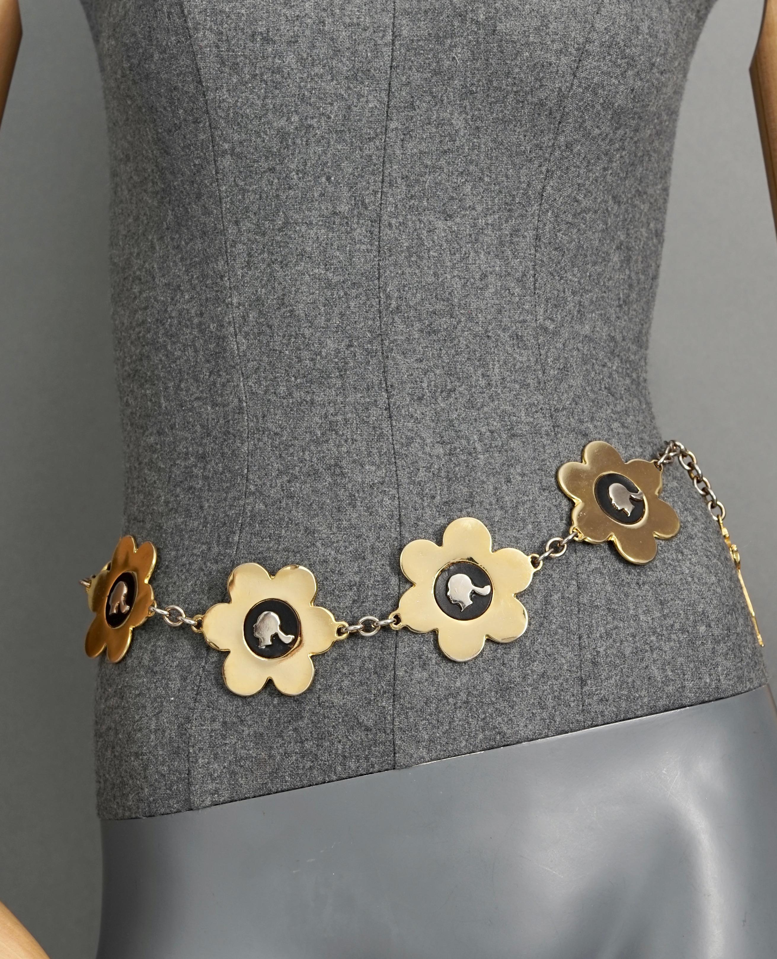 Vintage FRANCO MOSCHINO Profile Flower Novelty Belt

Measurements: 
Flower Height: 2.12 inches (5.4 cm)
Dangling Charm Height: 2.24 inches (5.7 cm)
Will fit waists: 23.62 inches to 27.55 inches (60 cm to 70 cm)

Features:
- 100% Authentic