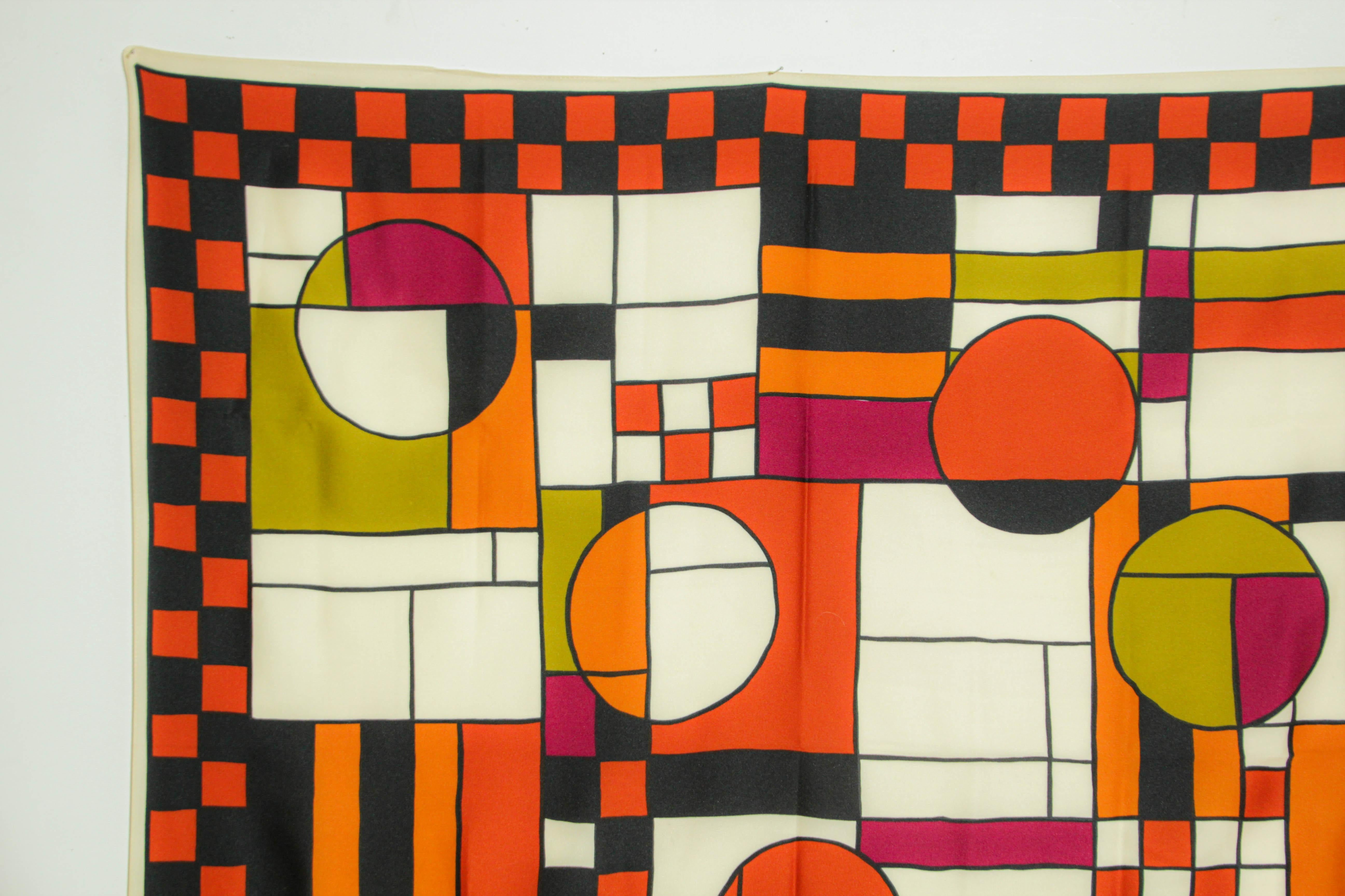 Vintage Frank Lloyd Wright Bauhaus Style Design Scarf.
Vibrant colors in green, brown, orange and white with geometric design, circles and rectangles.
Great to use framed as well.

This scarf is part of the Modern Museum of Art's (MoMA) Frank Lloyd