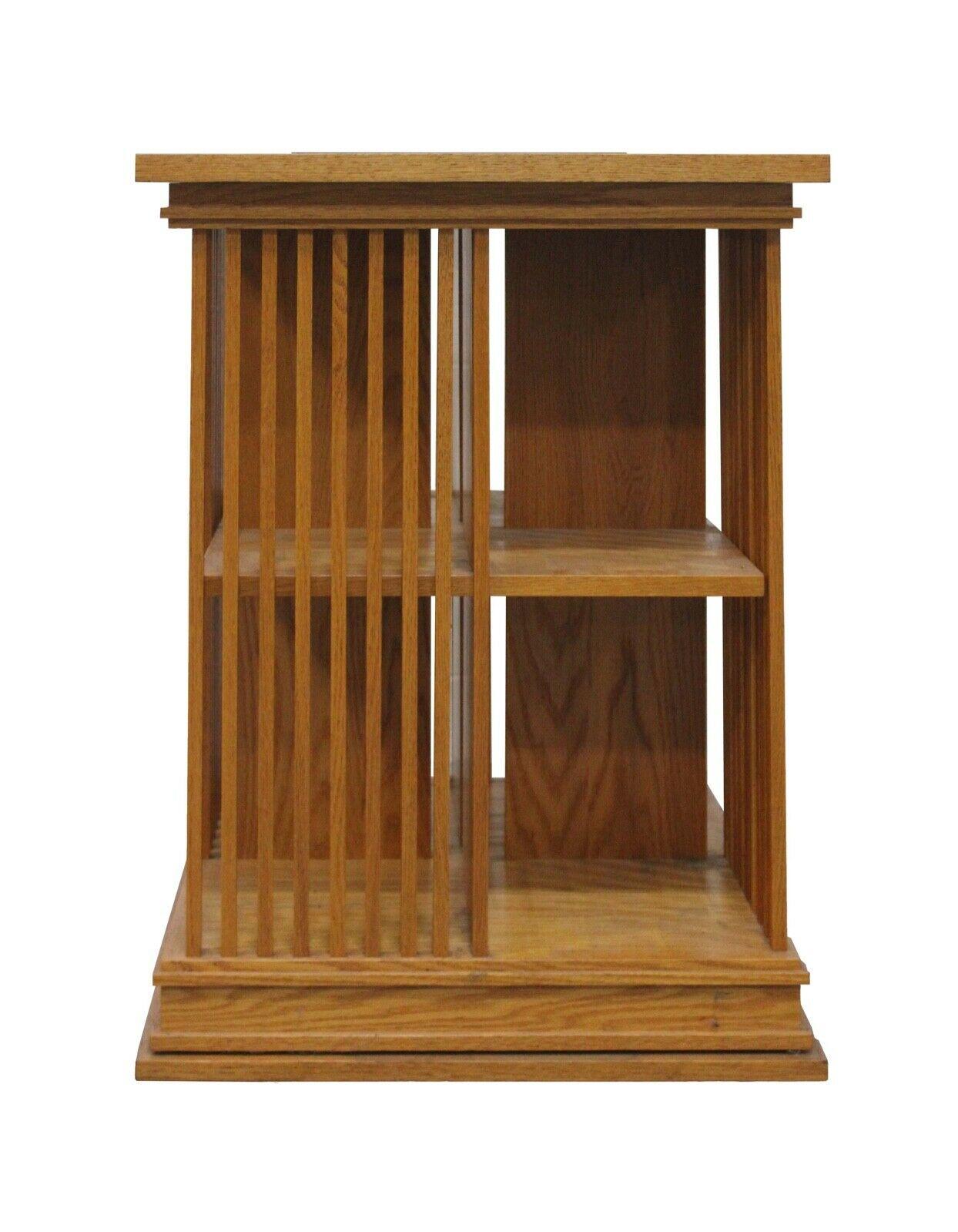 For your consideration is this stunning vintage, functional and artistic rotating bookcase in the style of Frank Lloyd Wright. Dimensions: 23 W x 23 D x 30.5 H.
 