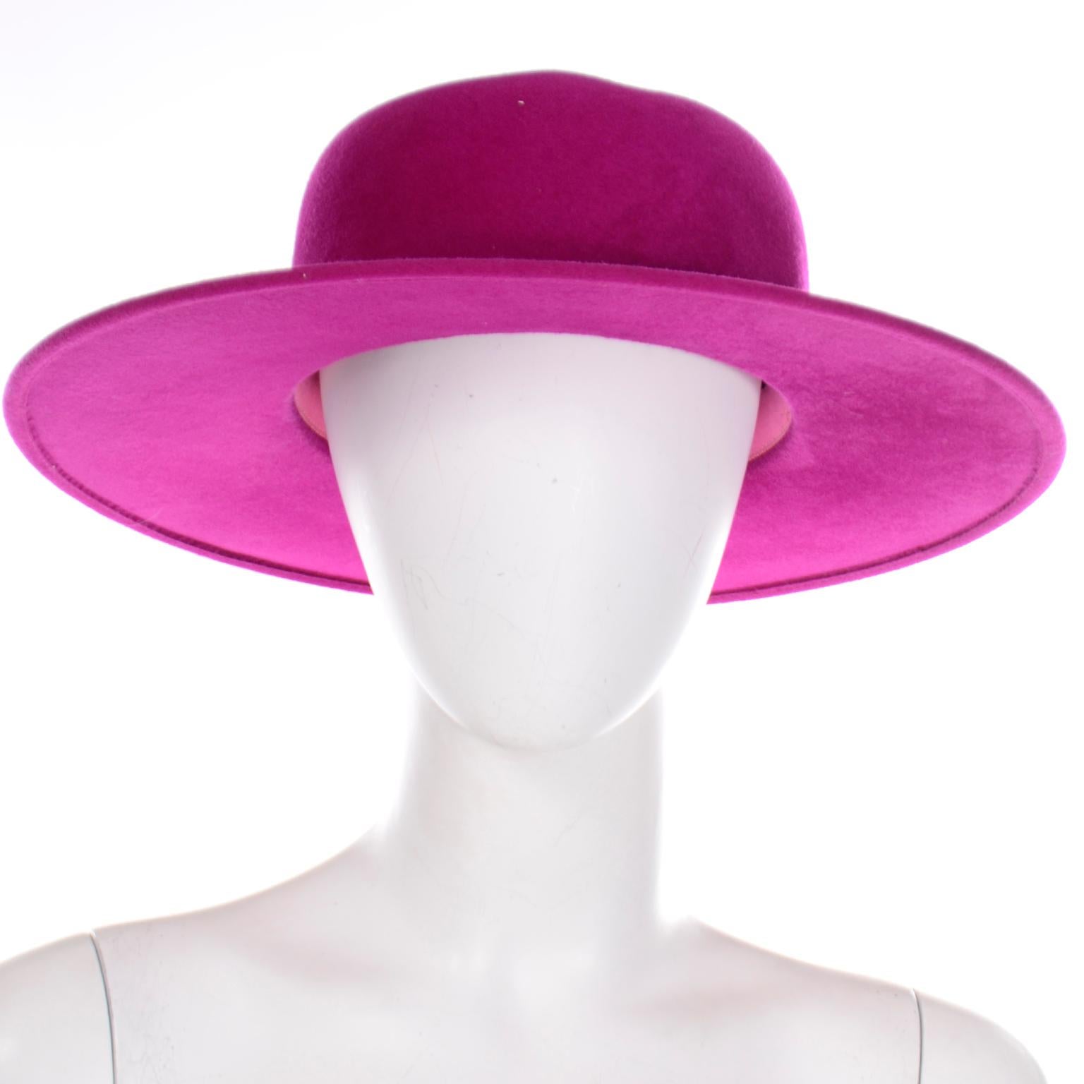 This pretty vintage magenta pink felted wool hat was designed by Frank Olive and has the I Magnin store label. This beautiful hat is so beautifully made and we love hats that have a nice brim! This would be a great hat to wear to any Spring event