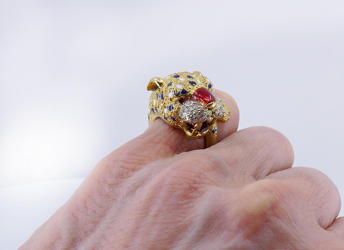         A fascinating vintage Frascarolo ring, made of 18k yellow gold, features diamond and enamel.
	The vintage ring is designed as a wrap up, featuring a leopard head and a tail. Both elements are adorned with white and blue enamel spots. The