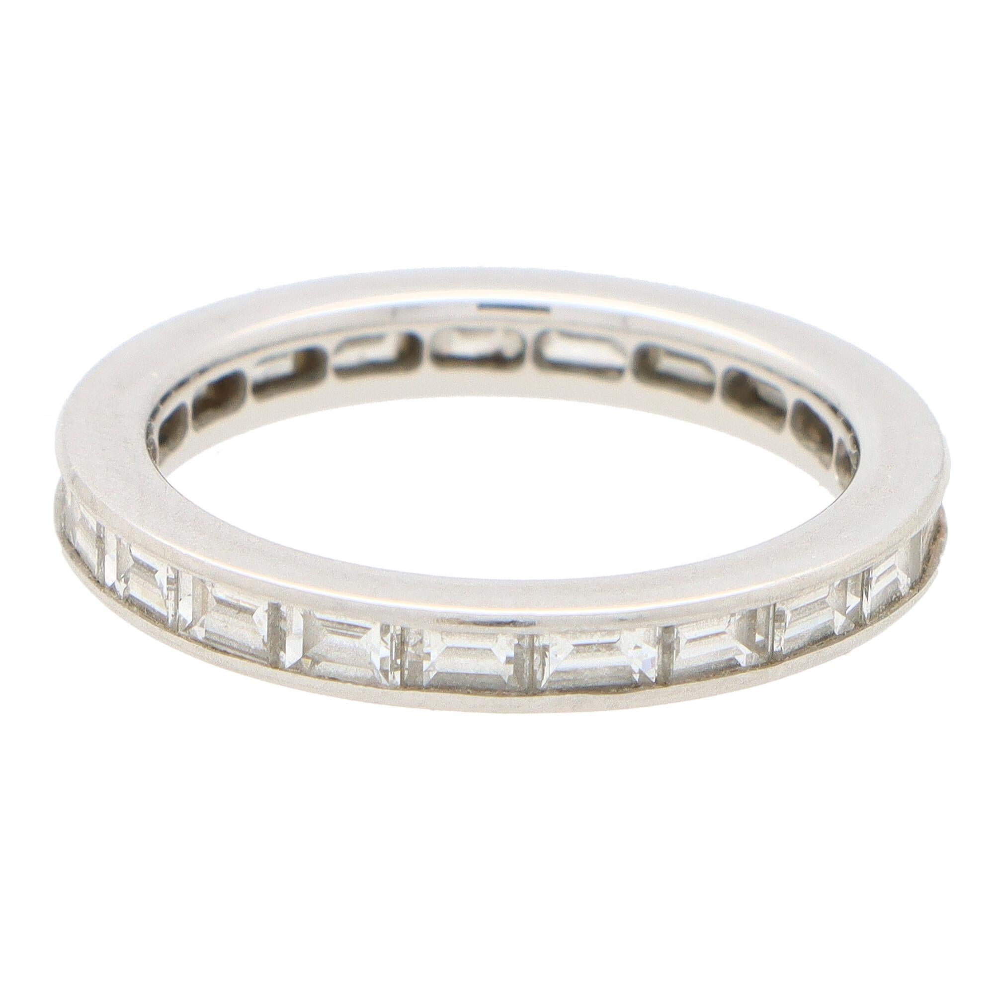  A lovely vintage Fred Paris baguette cut diamond full eternity ring set in platinum, signed Fred Paris.

The eternity ring is set with exactly 21 round baguette cut diamonds; all of which are bezel set within a 2.5-millimetre band (there is a