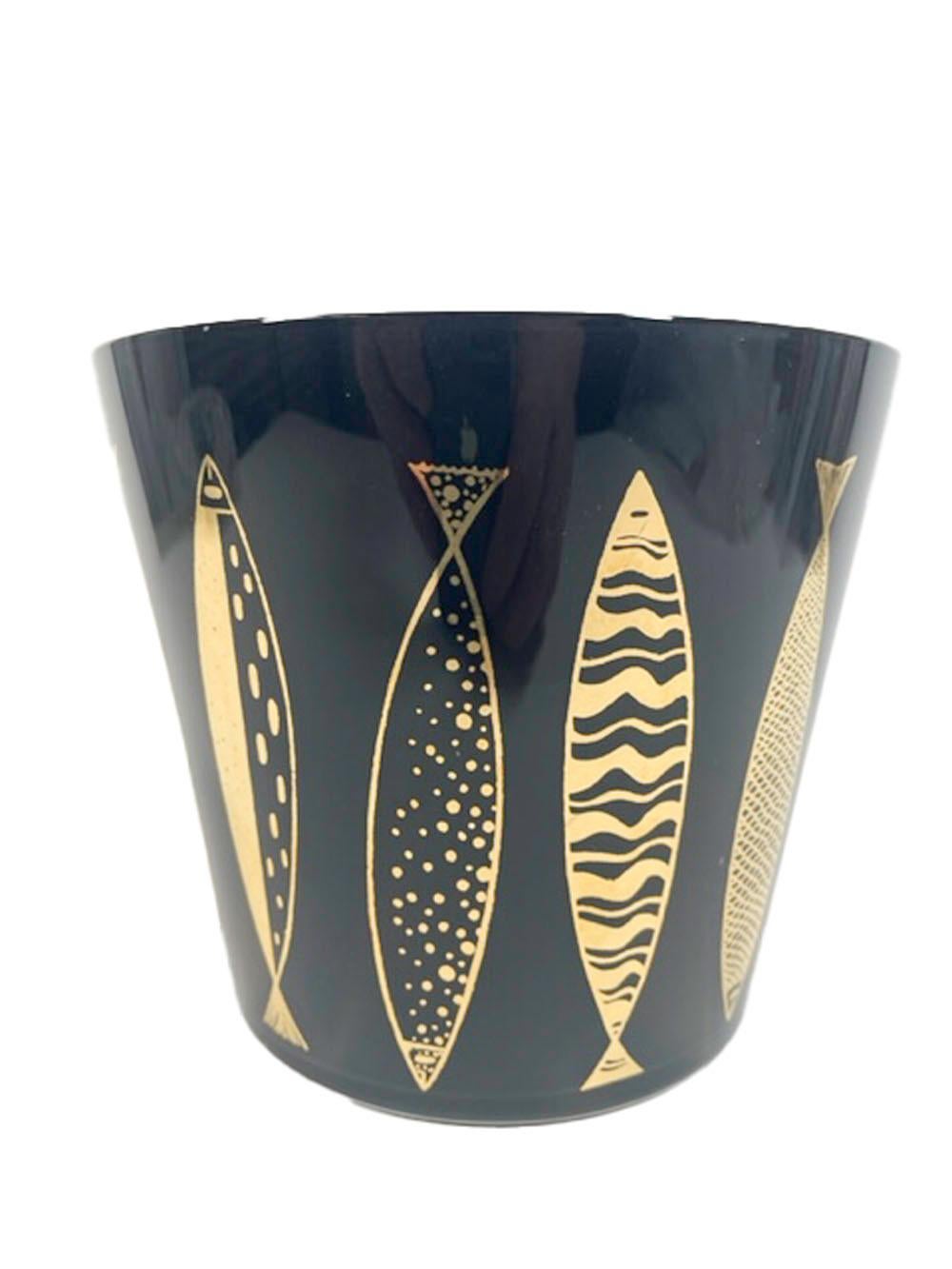 Mid-Century Modern ice bowl designed by Fred Press with 22k gold vertical stylized fish alternately pointing up or down on clear glass with interior black frosted surface.