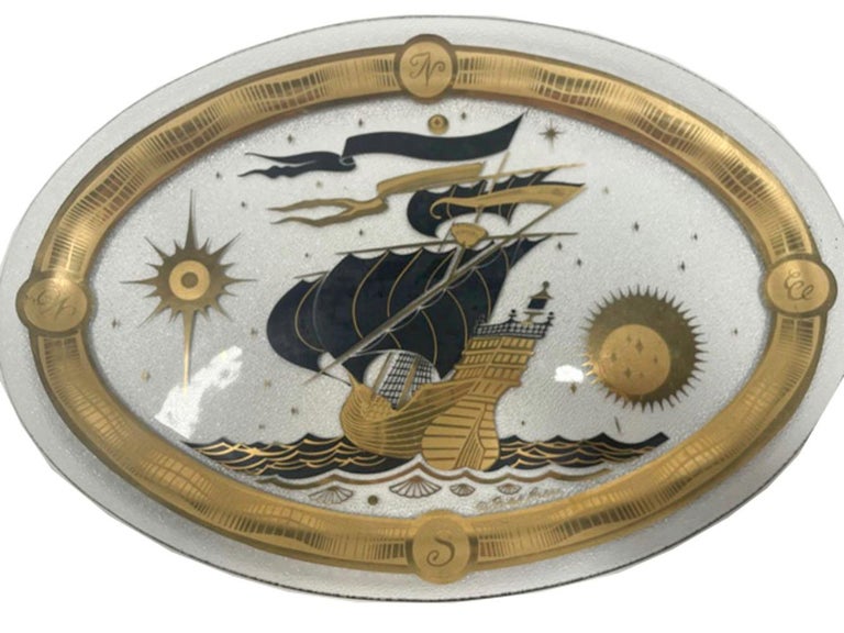 Mid-Century modern Fred Press designed nautical themed, molded glass serving tray. The back with a pebbled surface and the front decorated in 22k gold and enamels with a sailing ship within a gold border having the points of the compass.