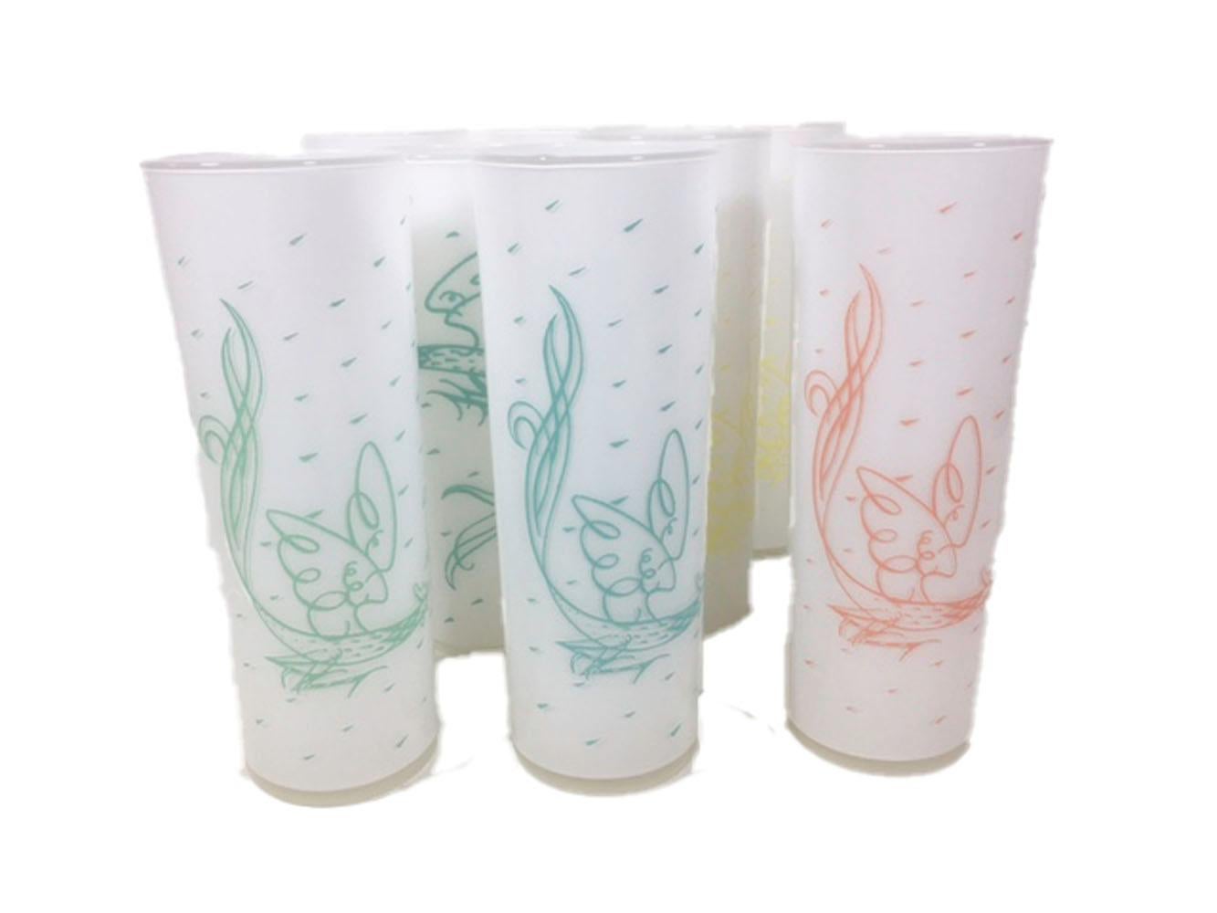 Set of 8 Fred press designed tom Collins glasses with drawings of roosters on clear glass with white frosted interior. Each glass is decorated in one of four colors, two of each color make the set. All in excellent condition.
