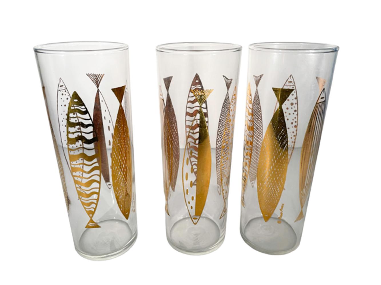 Six midcentury Tom Collins glassed in the Atomic style designed by Fred Press. Clear glass with 22k gold fish in various patterns.