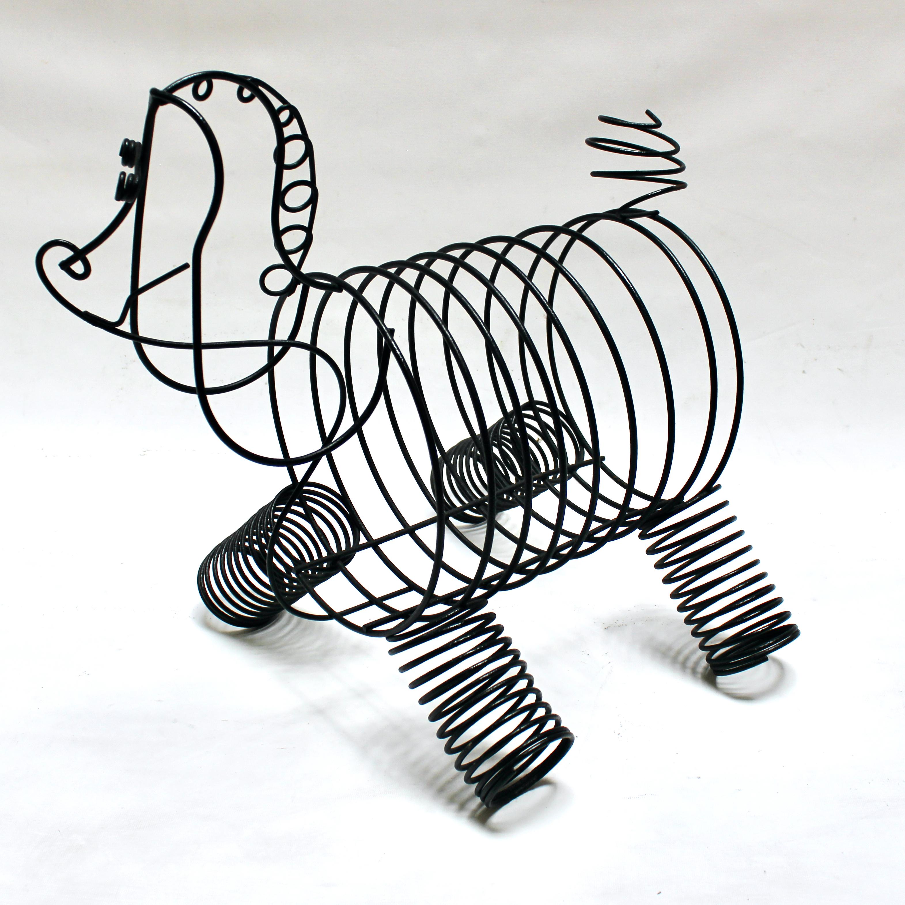 Vintage sculptural black metal poodle magazine holder or record rack by Frederic Weinberg. A delightful and whimsical sculpture that also functions as a storage piece. In excellent condition.

Measures: Width: 15 in / depth: 20 in / height: 19.25