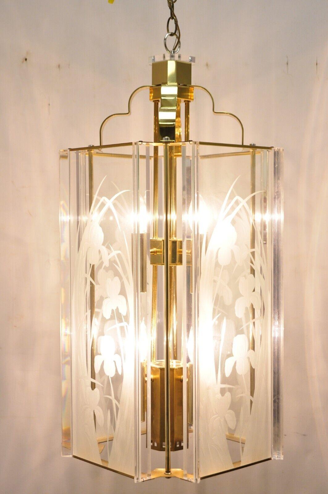Vintage Fredrick Ramond brass lucite glass pendant light chandelier. Item features (9) lights, etched glass panels, Lucite accents, brass frame, original stamp, great style and form. Circa 1985. Measurements: 32