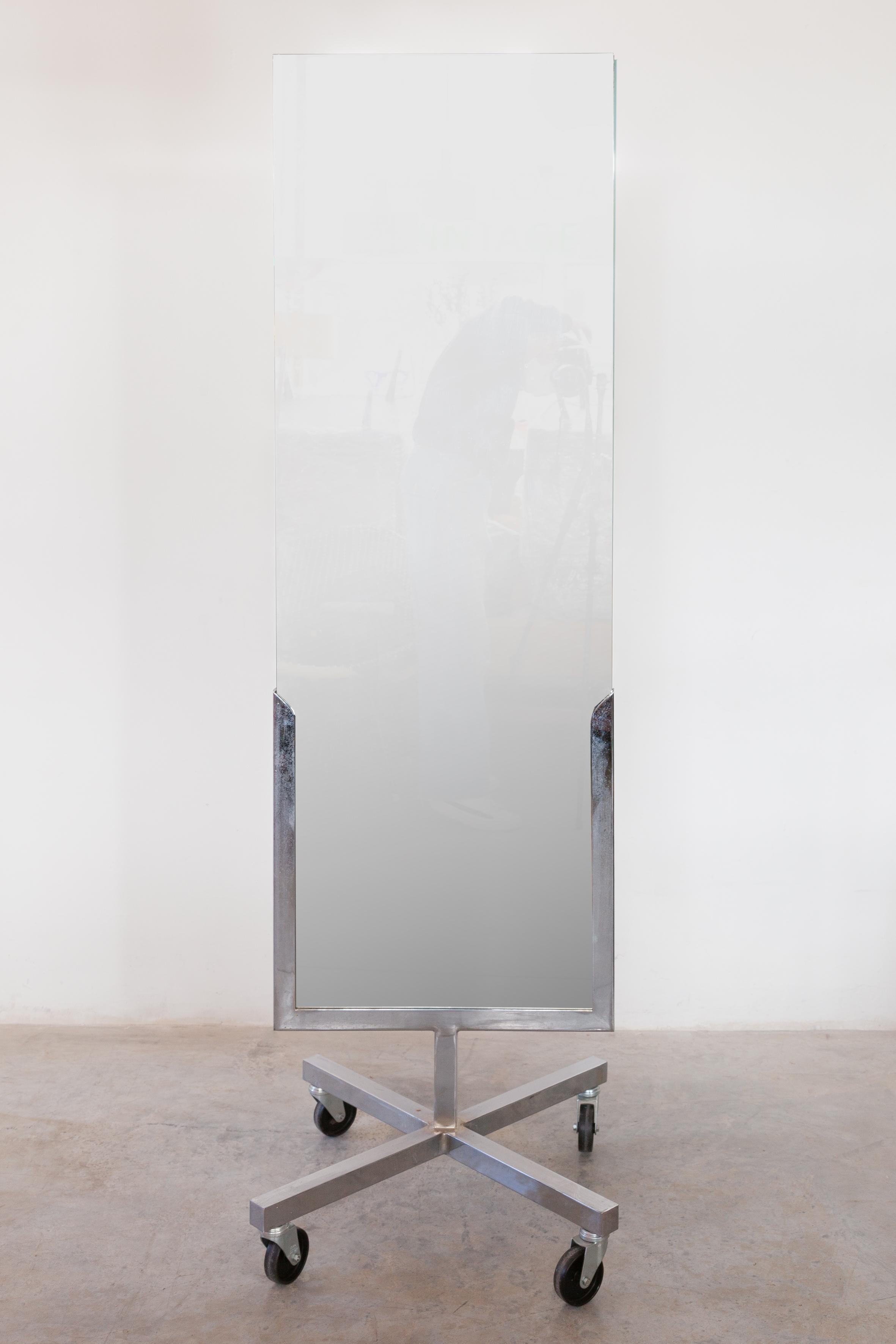 Freestanding rectangular full model length floor mirror double sided, movable on casters in any desired position made in Belgium, 1960s.
Dimensions: W 50, D 30, H 180 cm.