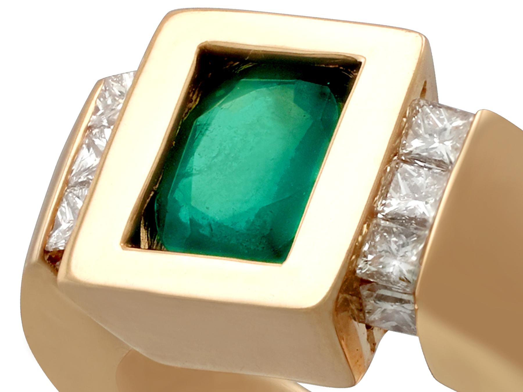 This large and impressive vintage French emerald and diamond ring has been crafted in 18k yellow gold.

The ring displays a central 1.29 carat oval cut emerald held within the substantial plain, polished, rectangular setting.

This vintage emerald