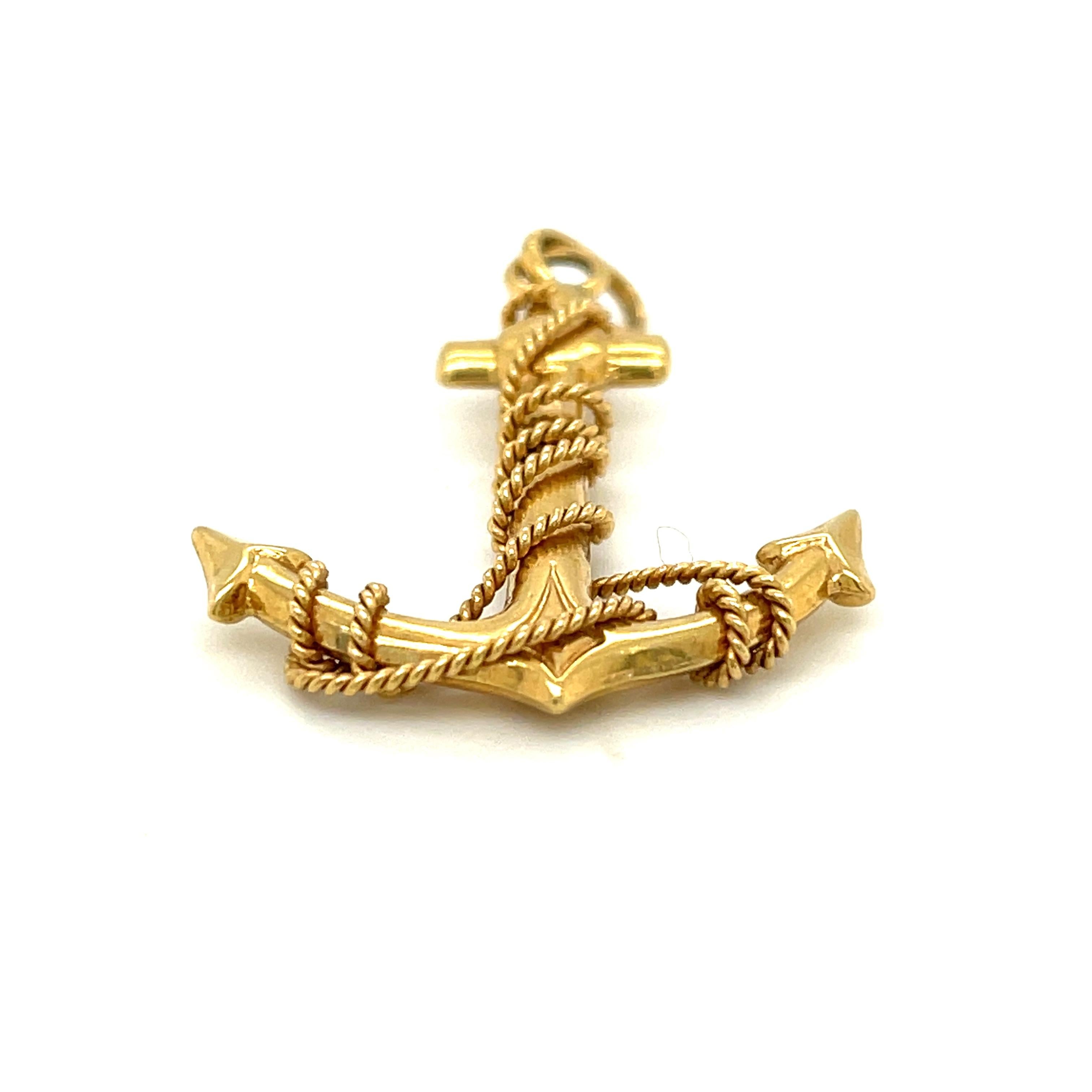 A vintage 18k yellow gold anchor pendant made in France circa 1990. Anchors have been an enduring symbol throughout jewelry design, often depicted with a Cross and Heart to symbolize Faith, Hope and Charity. The Anchor symbolizes hope and