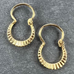 Boucles d'oreilles vintage en or jaune 18 carats à levier et à crête