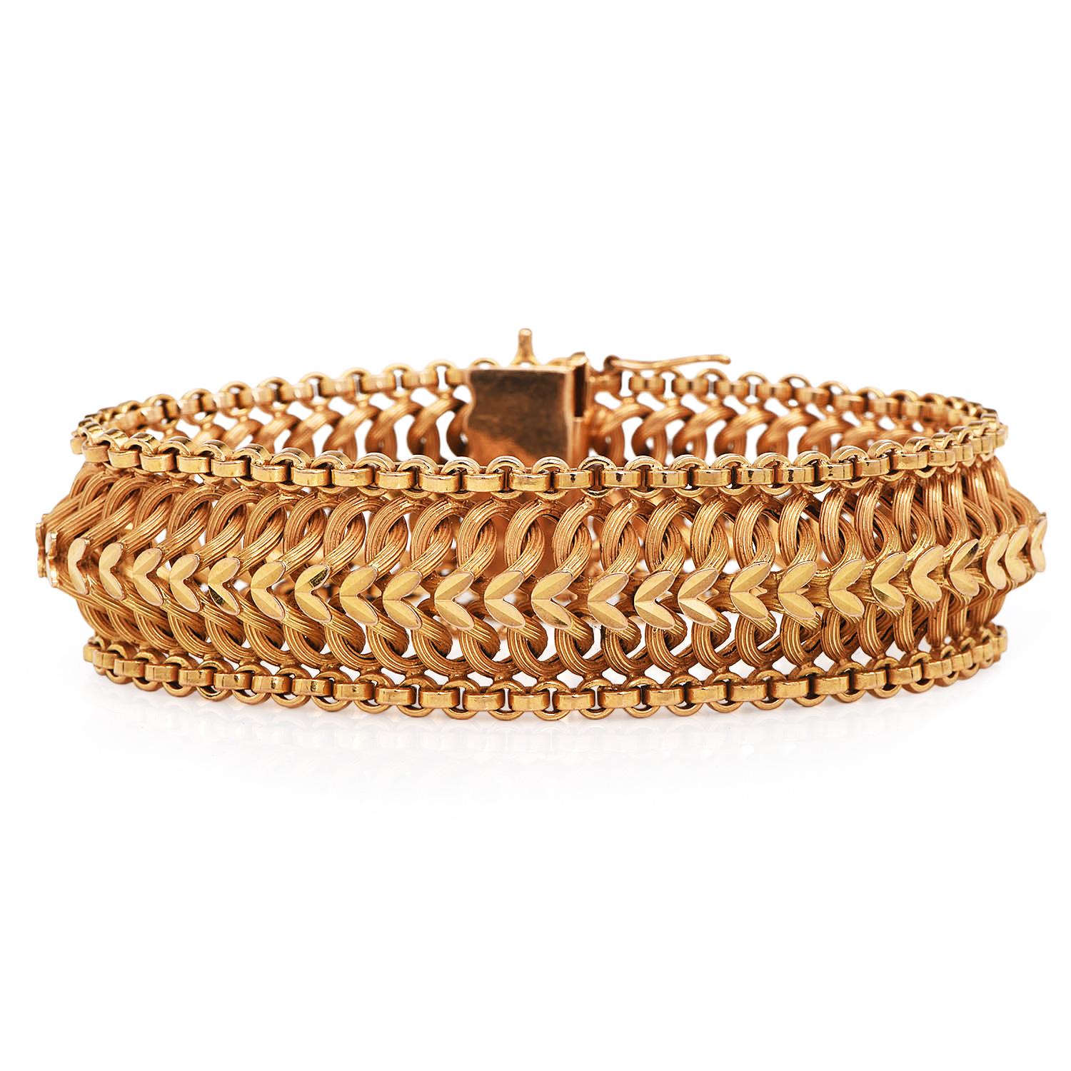 Make Someone Happy with this French vintage gold bracelet, circa 1960,

18K Leaf wide bracelet.  

Each woven links offer flexibility and comfort.  

Each leaf has a ribbed Center and is very comfortable to wear.

 Measuring appx. 7inches in length