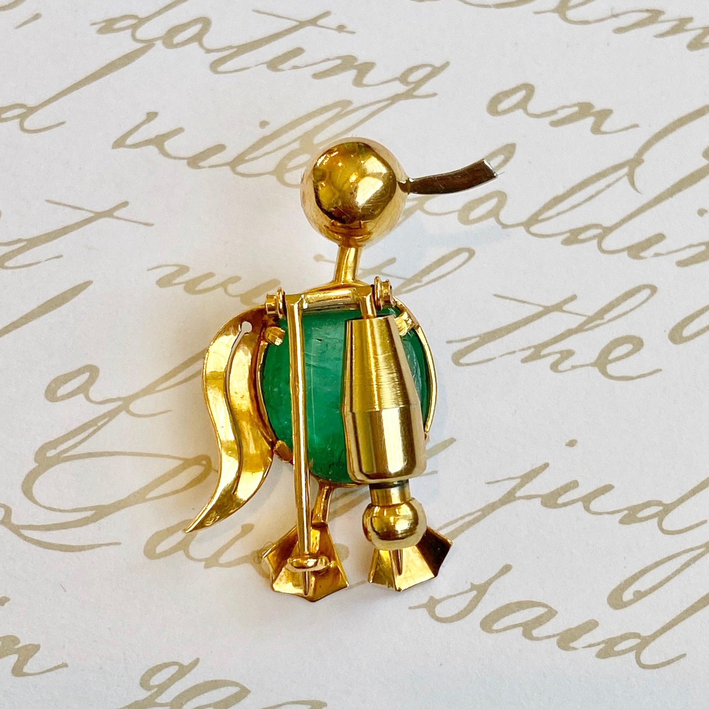 Vintage 18K yellow gold emerald cabochon bird brooch with white gold beak and eye.
Emerald: approx. 8.0ct.
Measurements: 32mm H x 22mm W x 11.5mm D
Weight: 6.2 grams
Stamped with the French 18K gold hallmark.