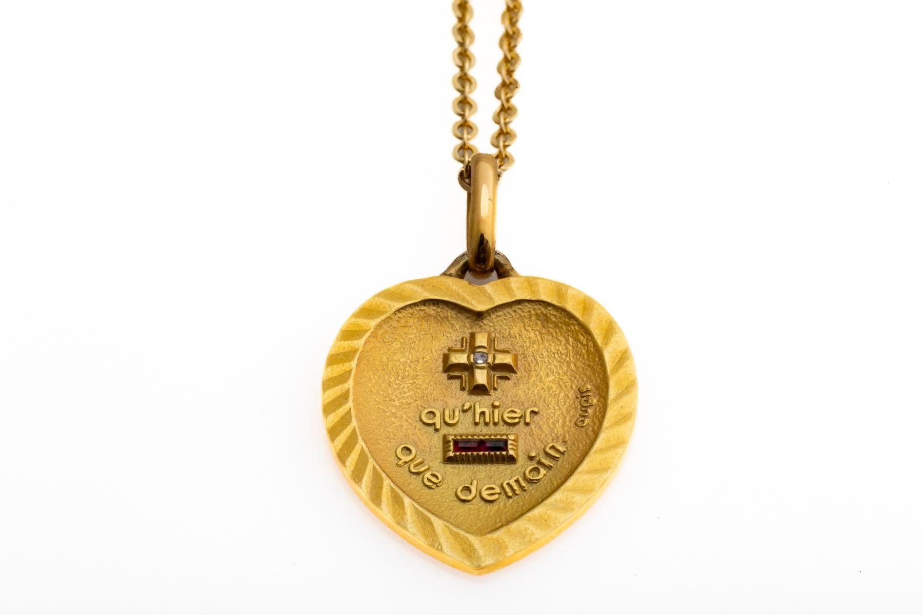 I Love you more than yesterday but Less than tomorrow is written on the 18Kt Augis Heart Love Token. Inscribed in French 